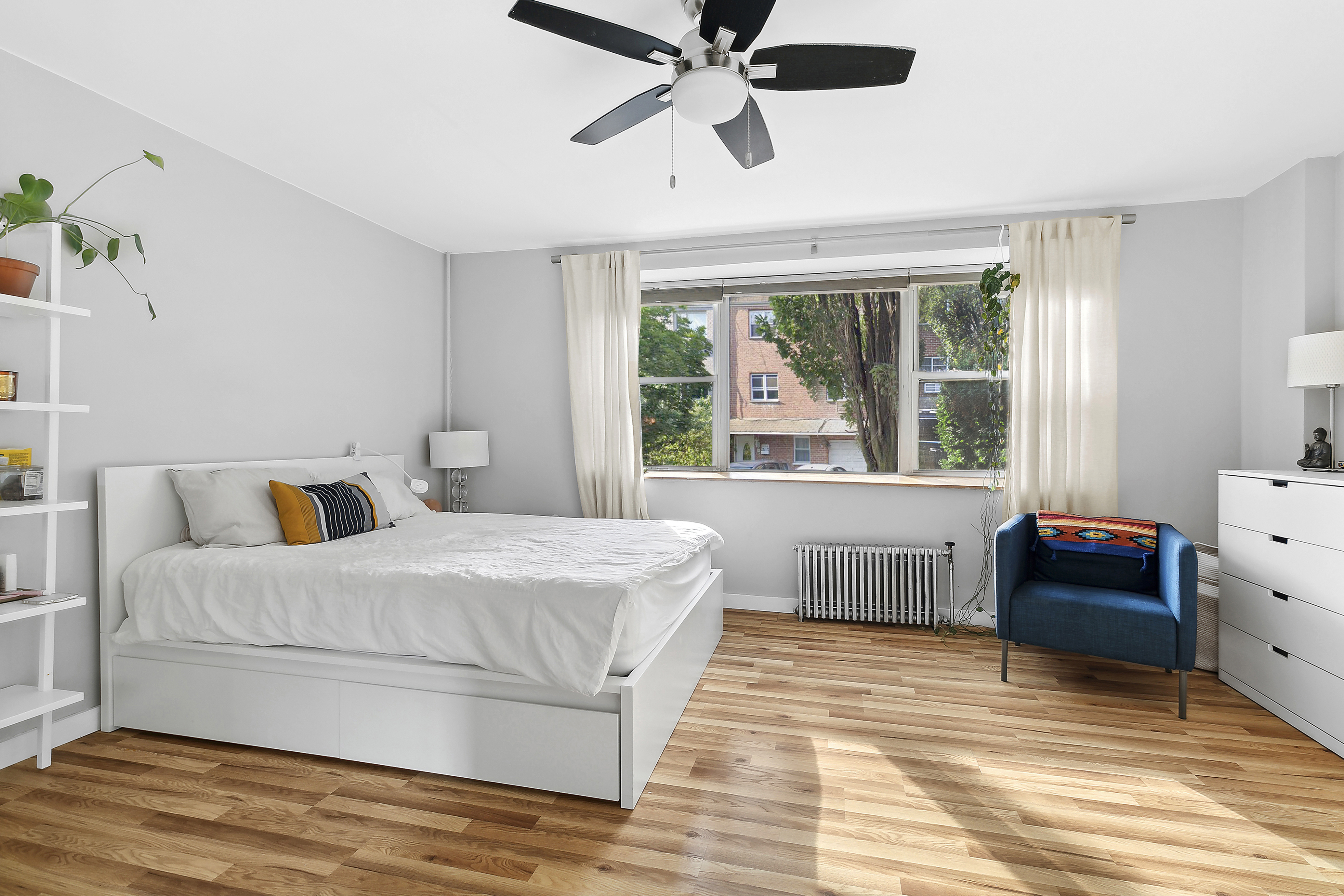 131 Java Street Brooklyn, NY 11222 - Photo 5 of 12 a bedroom with a bed and a large window