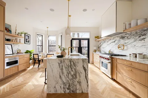a dining room with furniture a chandelier and window