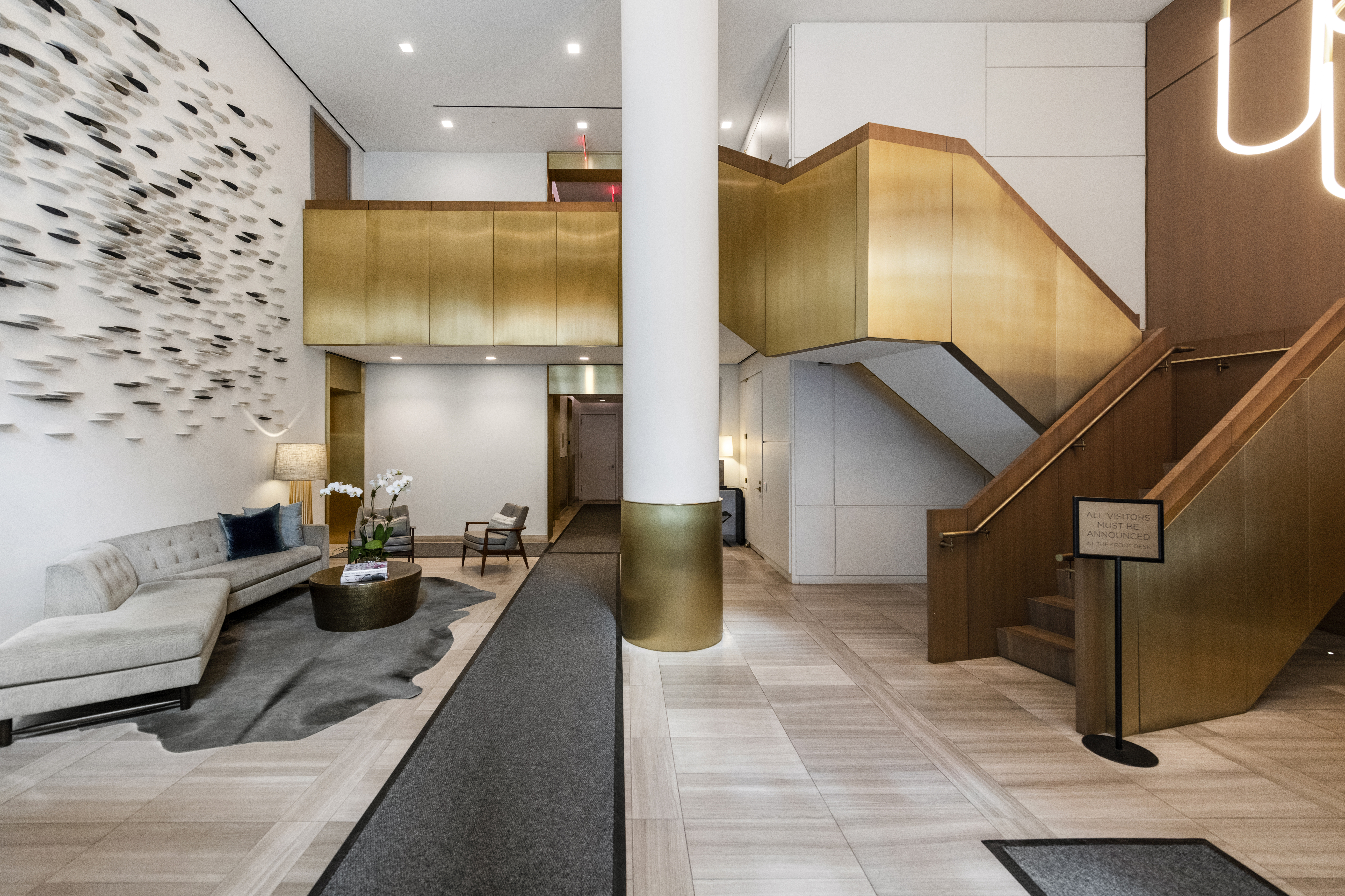 305 East 51st Street, Unit 11D Manhattan, NY 10022 - Photo 11 of 18 a lobby with furniture and a potted plant
