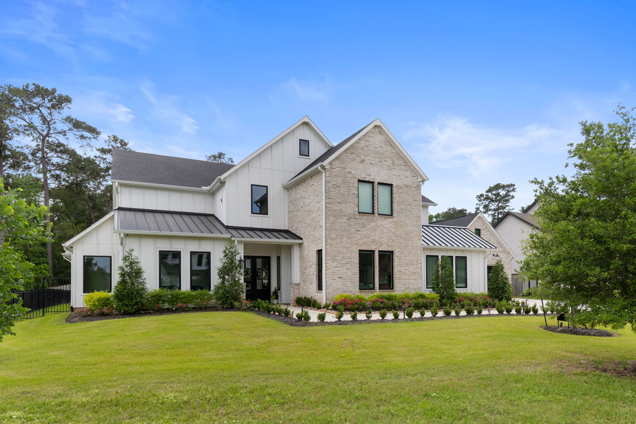 2118 Bennet Court Conroe, TX 77384 - Photo 1 of 70 a front view of a house with a yard