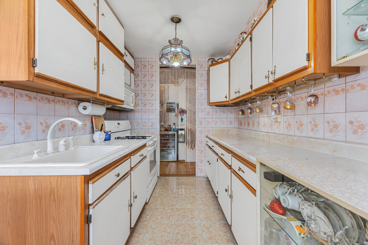 135 Ashland Place, Unit 8B Brooklyn, NY 11201 - Photo 6 of 11 a kitchen with stainless steel appliances granite countertop a sink and dishwasher