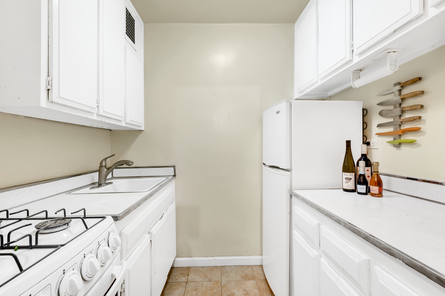 10 West 15th Street, Unit 713 Manhattan, NY 10011 - Photo 4 of 6 a kitchen with a sink and cabinets