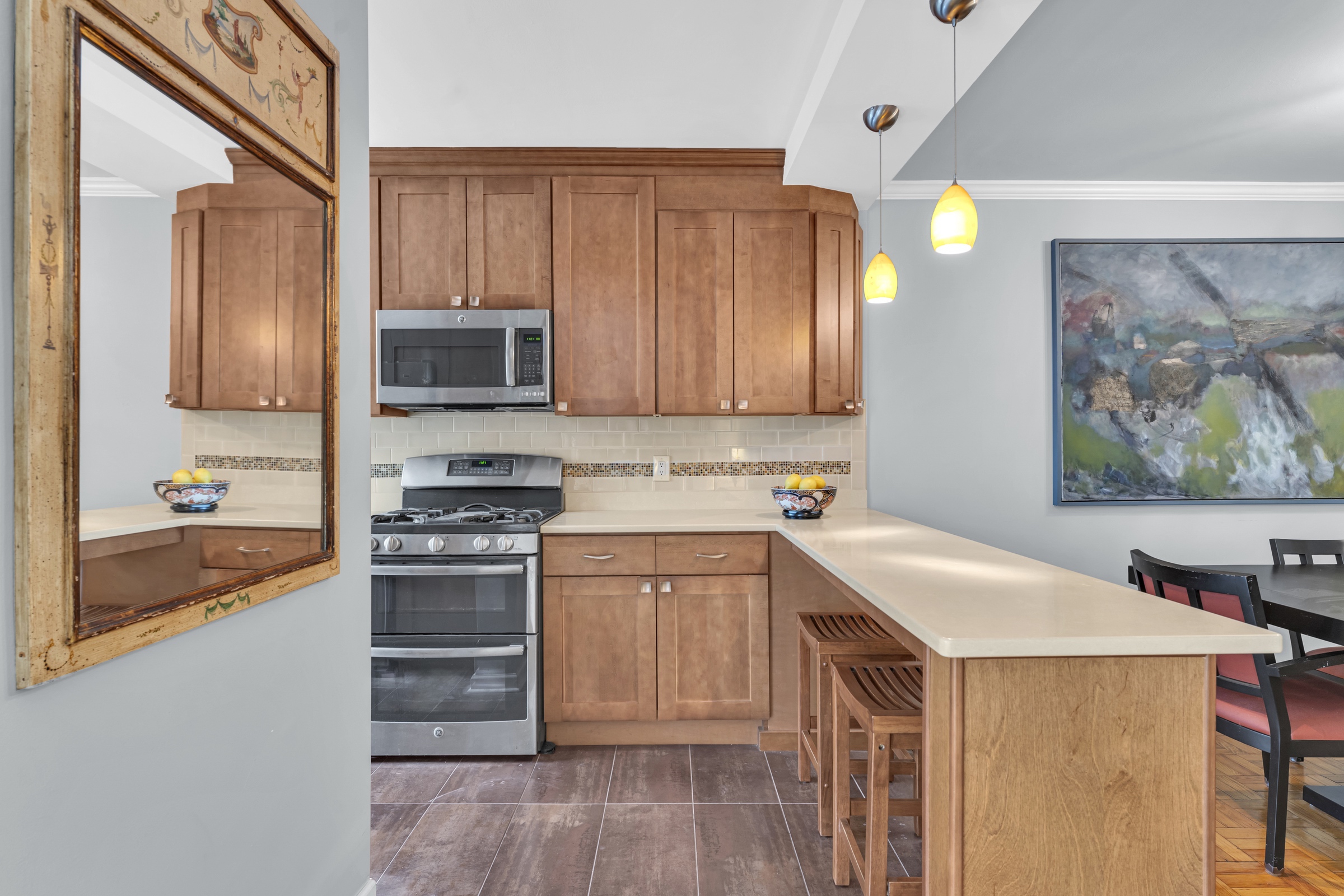 750 Kappock Street, Unit 307 Bronx, NY 10463 - Photo 5 of 20 a kitchen with a stove a sink and a microwave