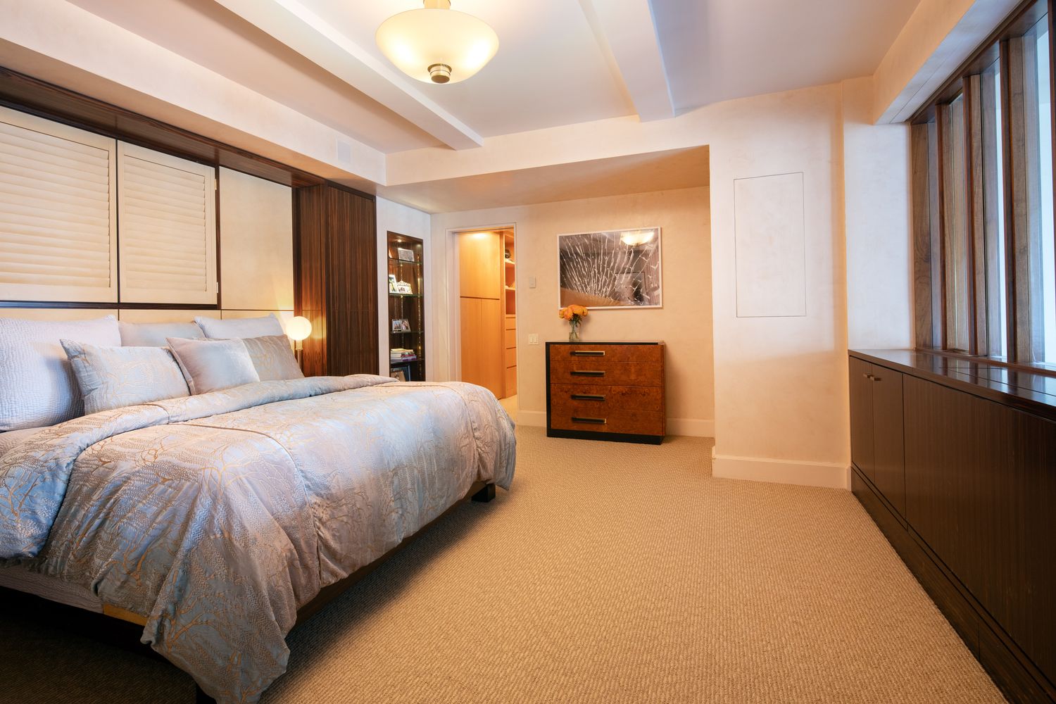 a spacious bedroom with a bed and window