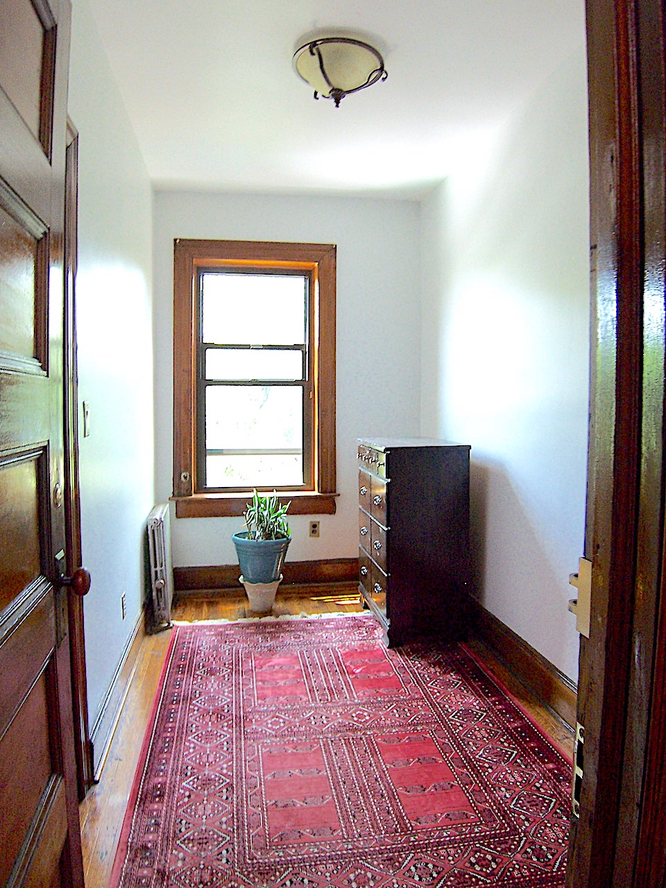 864 Prospect Place, Unit 2 Brooklyn, NY 11216 - Photo 4 of 6 a bedroom with a bed and wooden floor