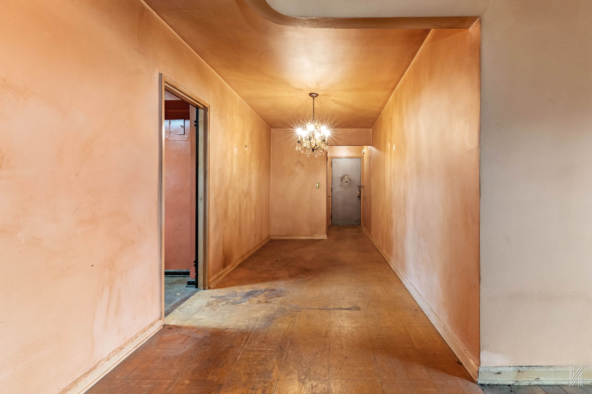 33-05 90th Street, Unit 4F Queens, NY 11372 - Photo 6 of 18 a view of a hallway with wooden floor