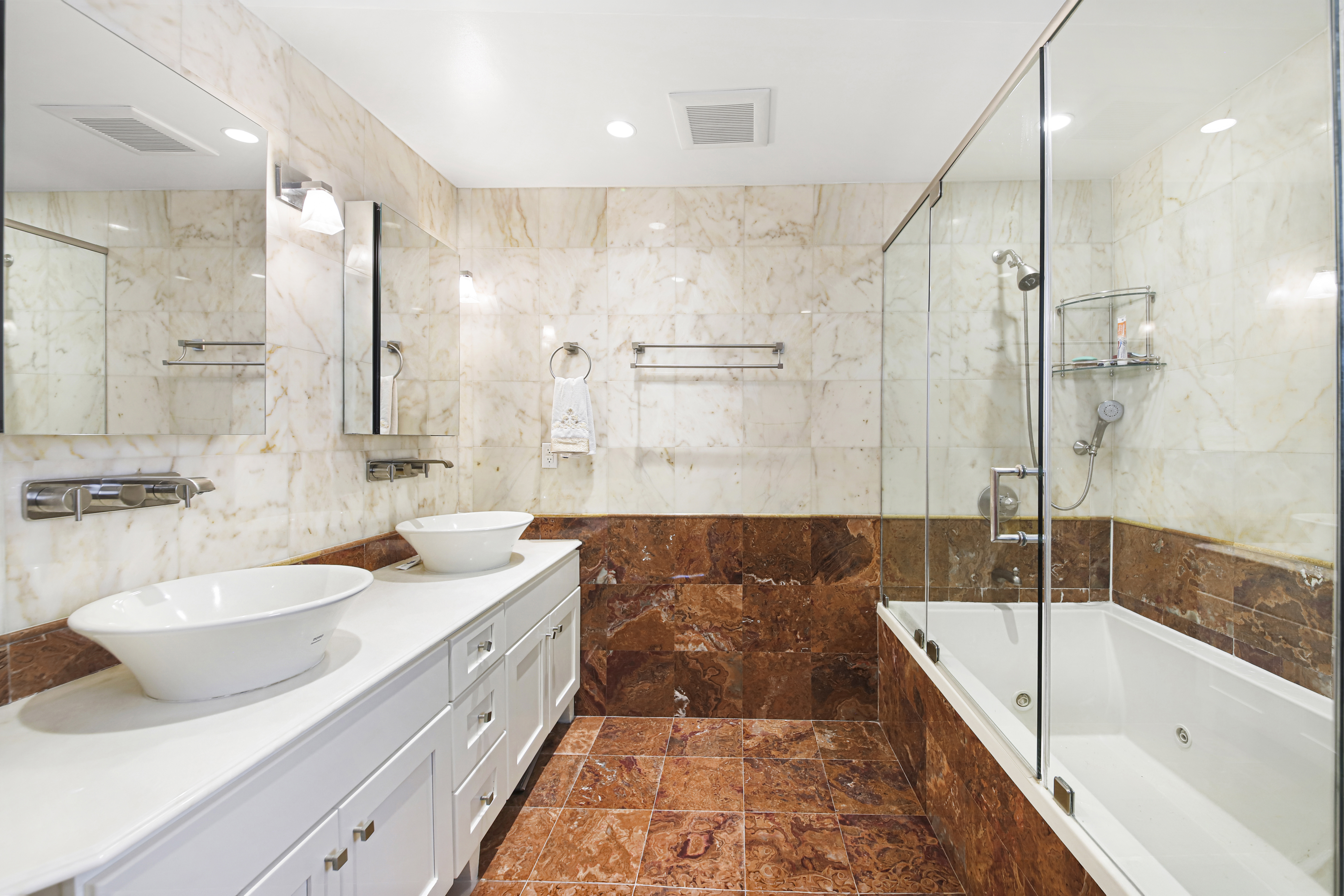 2310 East 66th Street Brooklyn, NY 11234 - Photo 21 of 24 a spacious bathroom with a tub sink and mirror
