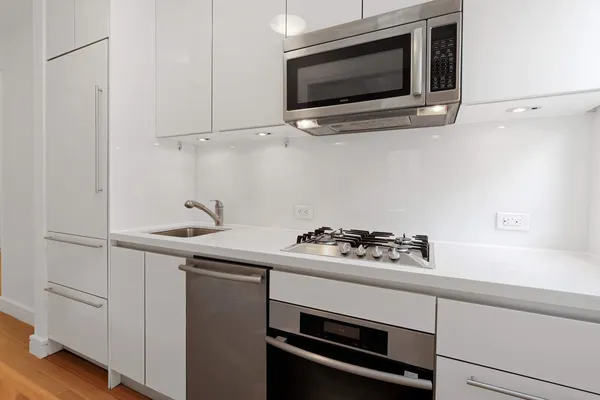 a kitchen with a stove and a microwave