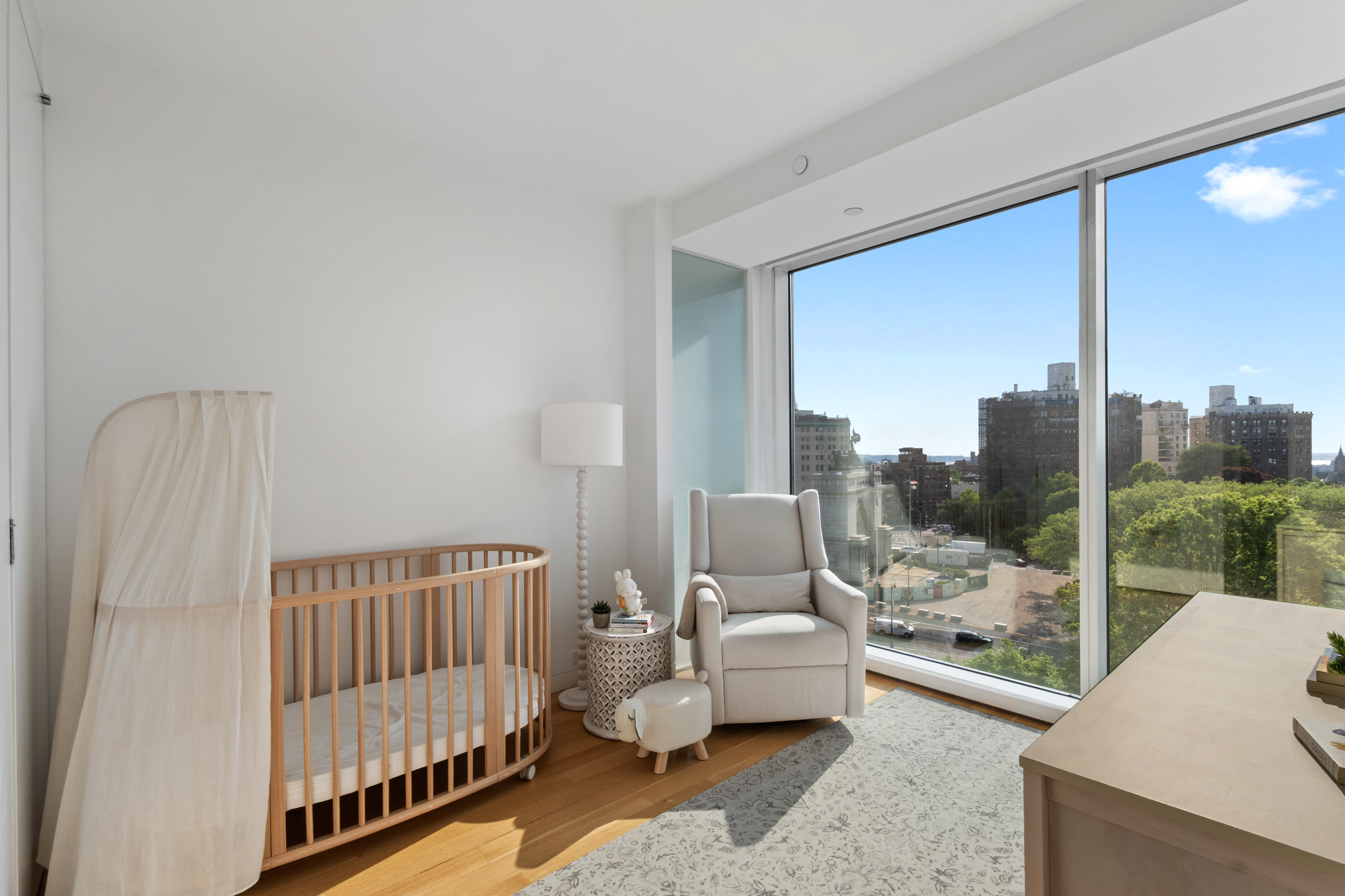 1 Grand Army Plaza, Unit 9D Brooklyn, NY 11238 - Photo 9 of 20 a bedroom with furniture and a large window