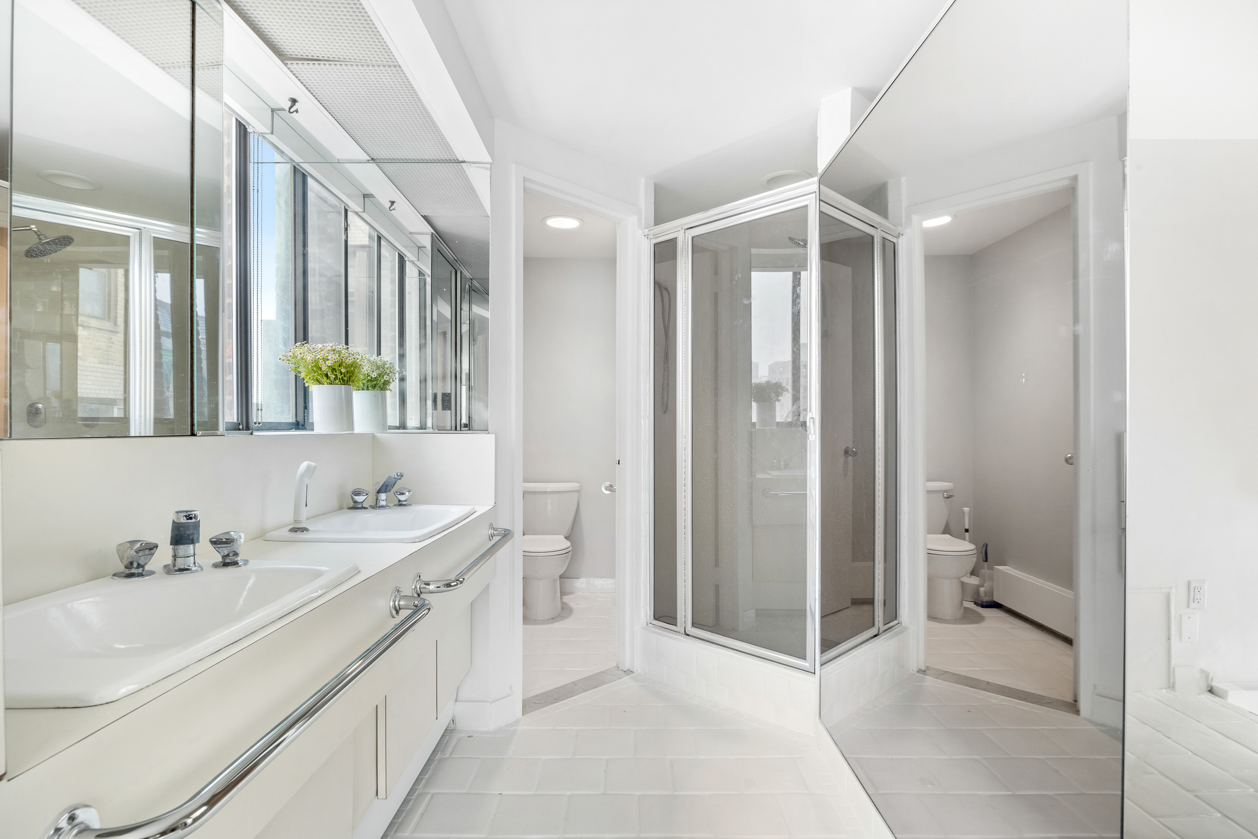 330 West End Avenue, Unit PHB Manhattan, NY 10023 - Photo 12 of 20 a bathroom with a double vanity sink toilet and shower