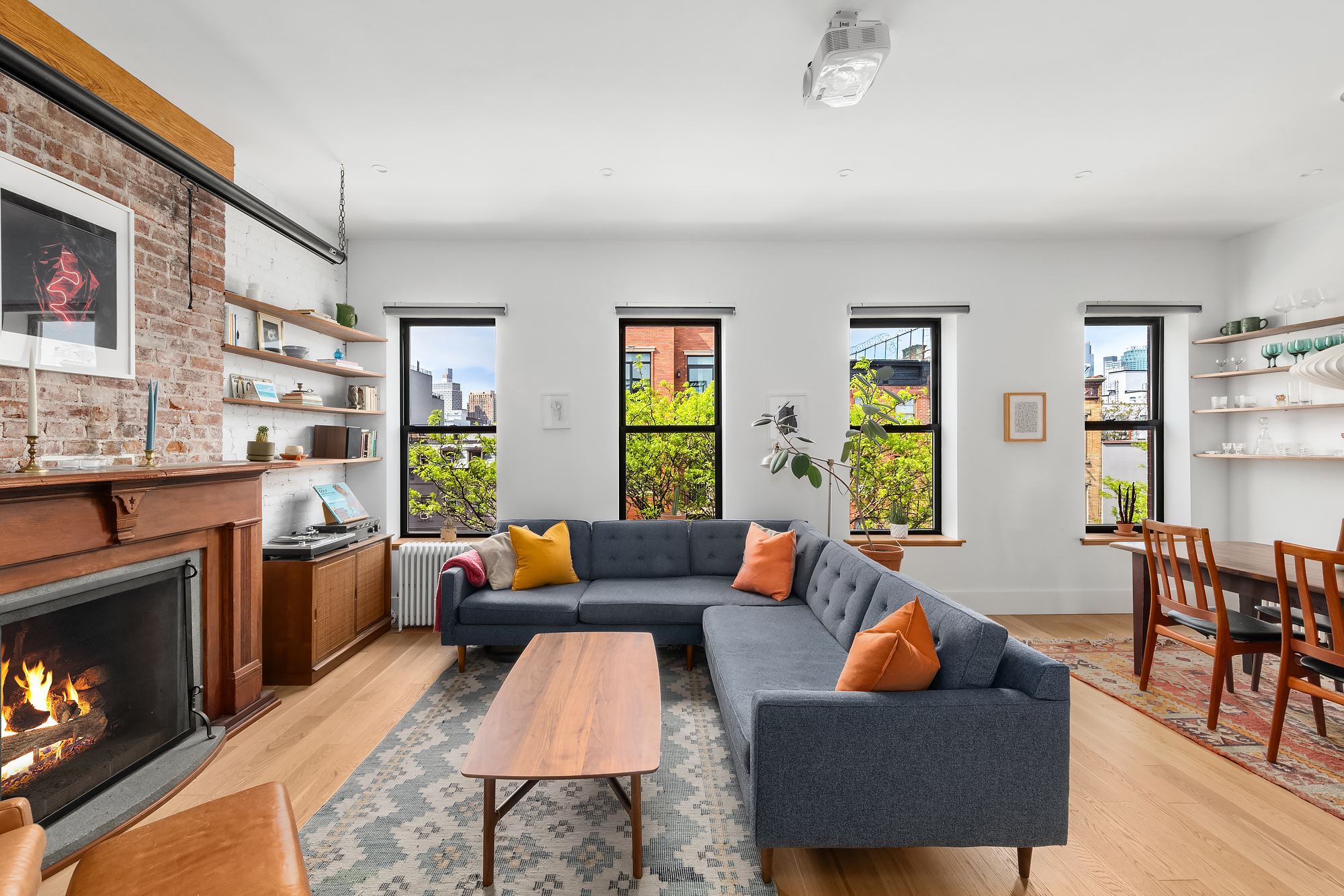 102 Clay Street, Unit 4 Brooklyn, NY 11222 - Photo 2 of 13 a living room with furniture and a fireplace