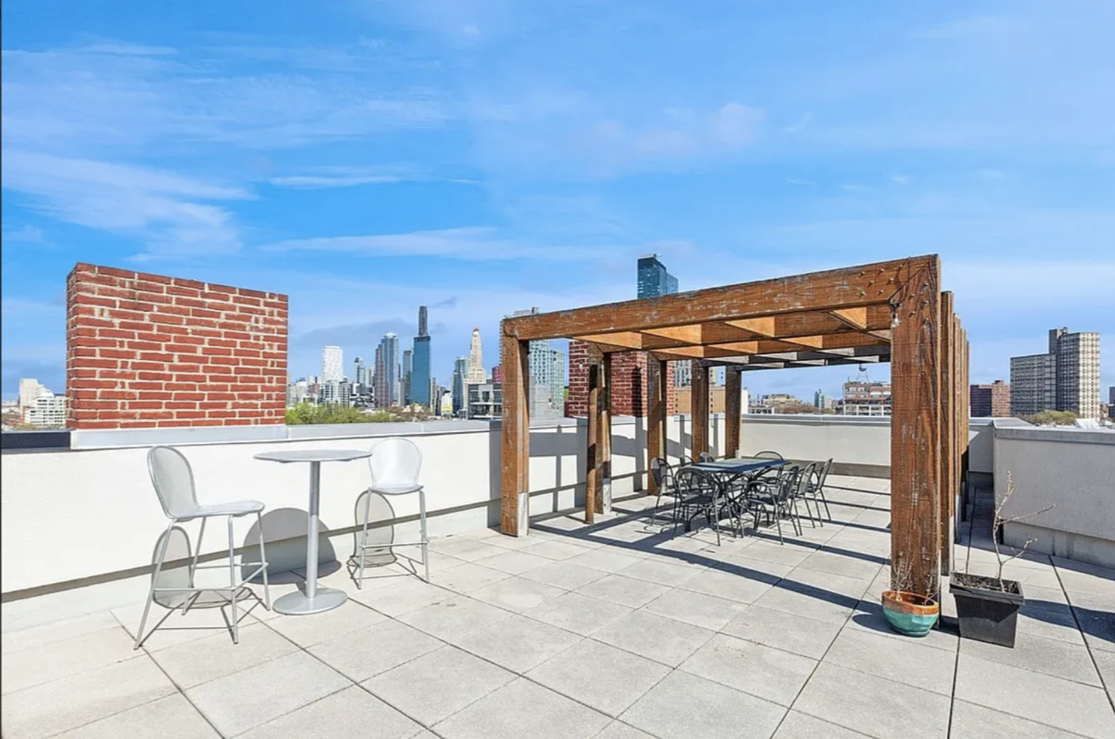 145 Park Place, Unit 4E Brooklyn, NY 11217 - Photo 13 of 15 a view of a patio with a table and chairs