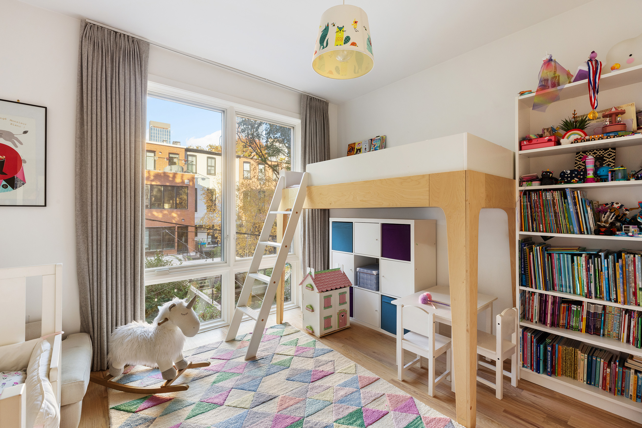 207 Wyckoff Street, Unit 2 Brooklyn, NY 11217 - Photo 11 of 15 a living room with furniture and a book shelf