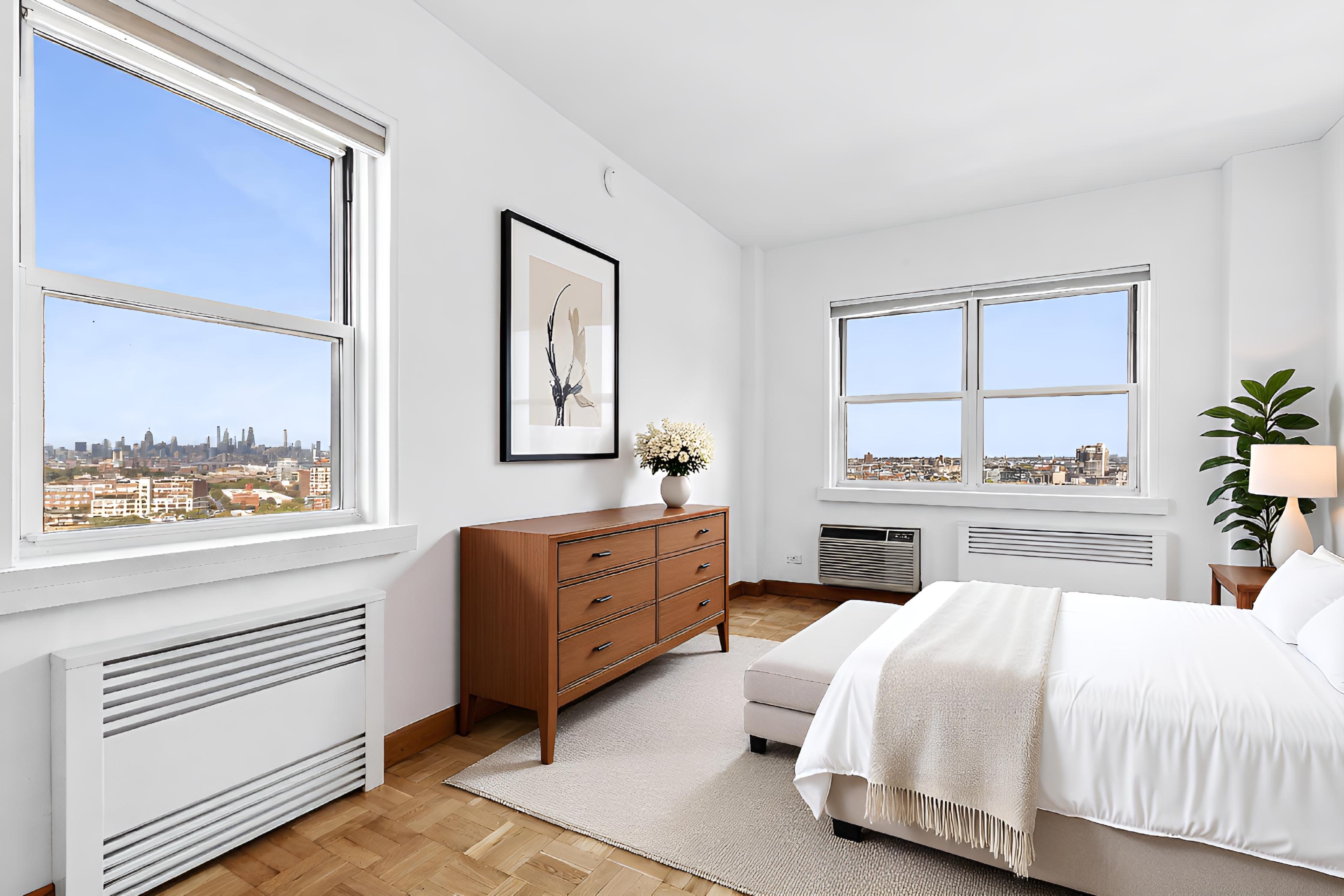 10 Plaza Street East, Unit 16C Brooklyn, NY 11238 - Photo 3 of 6 a bedroom with a bed and a large window with balcony view