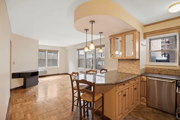 a dining room with furniture and window
