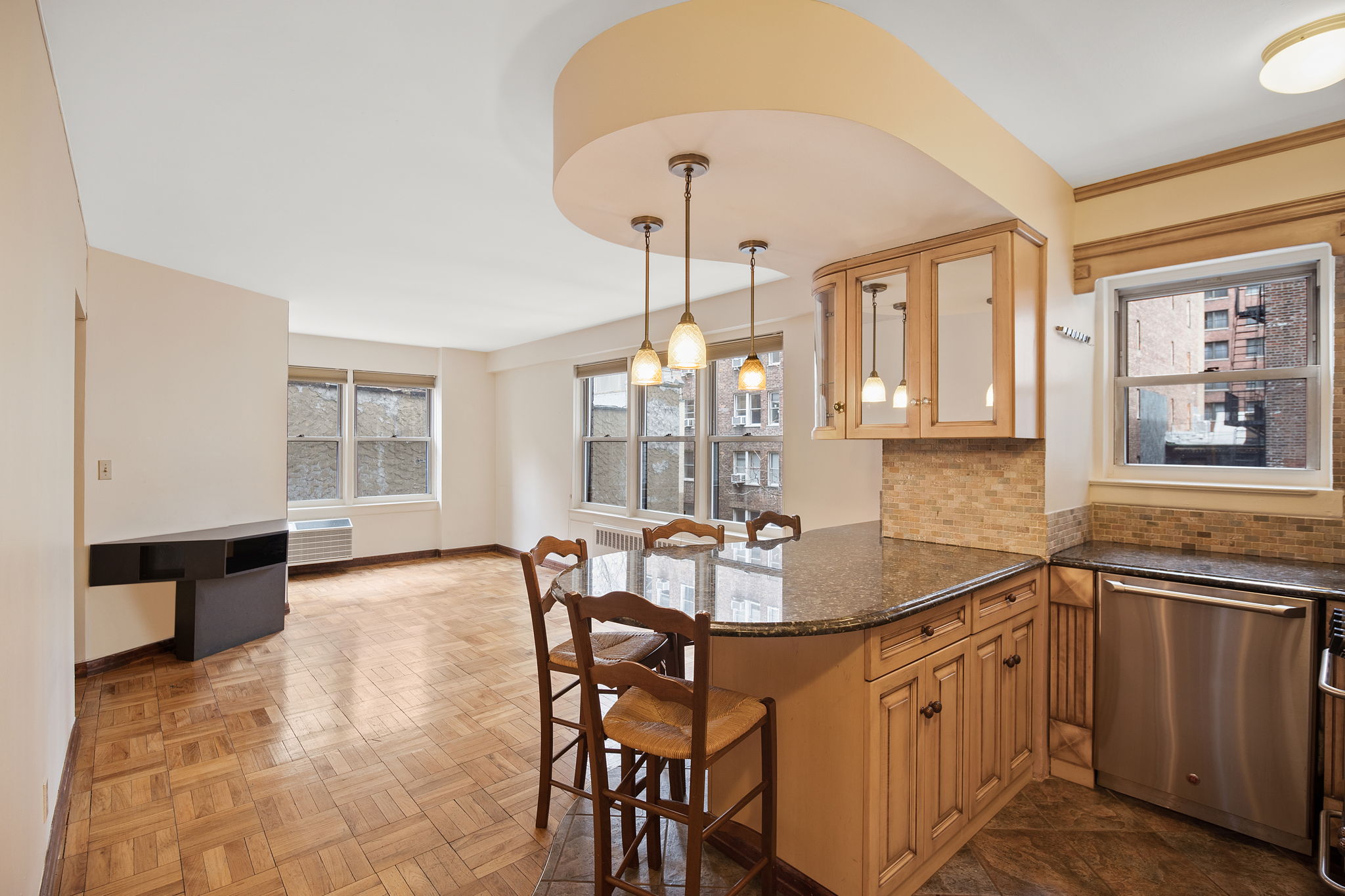 155 East 38th Street, Unit 5L Manhattan, NY 10016 - Photo 1 of 9 a dining room with furniture and window