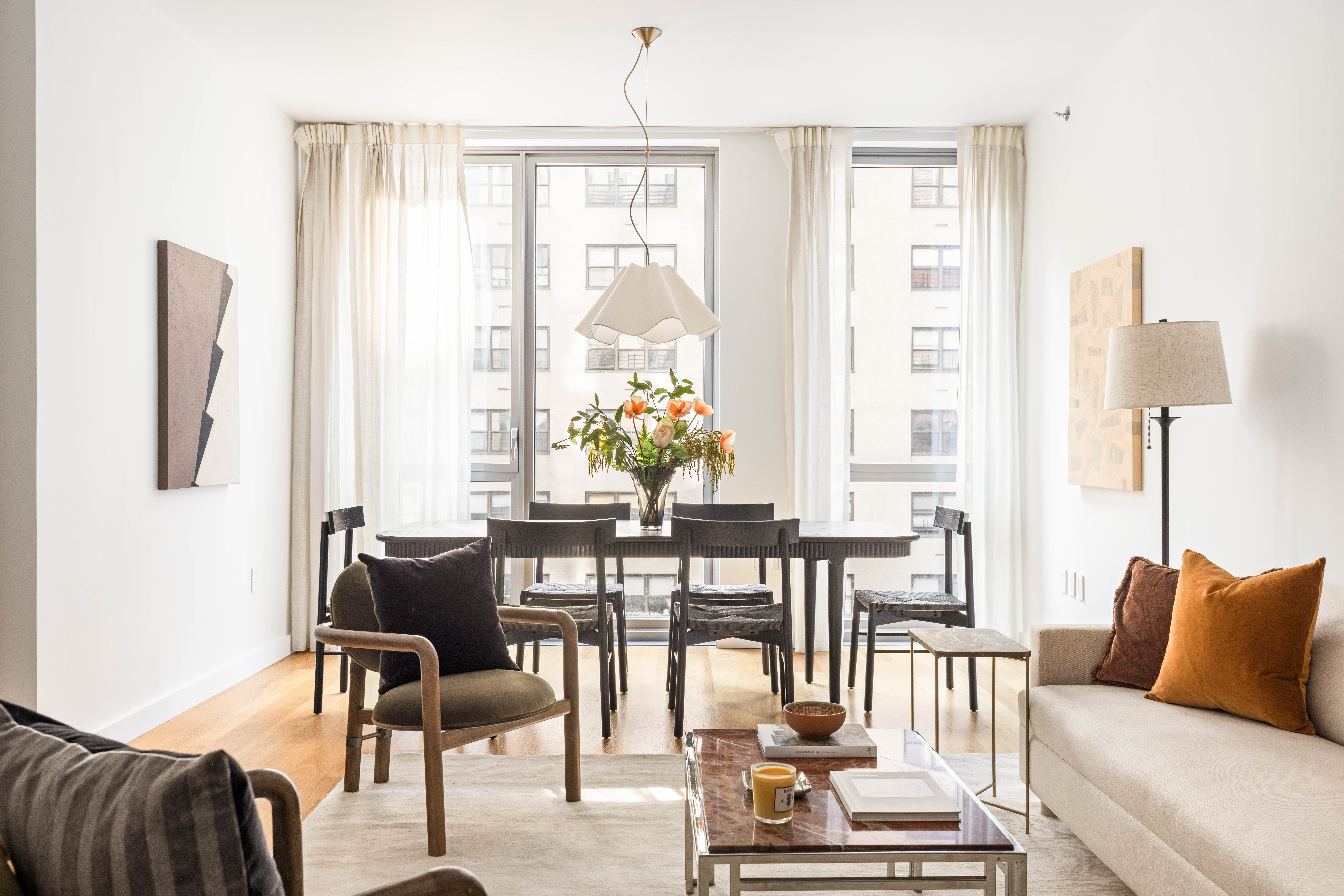 360 East 89th Street, Unit 5D Manhattan, NY 10128 - Photo 4 of 13 a living room with furniture and a large window