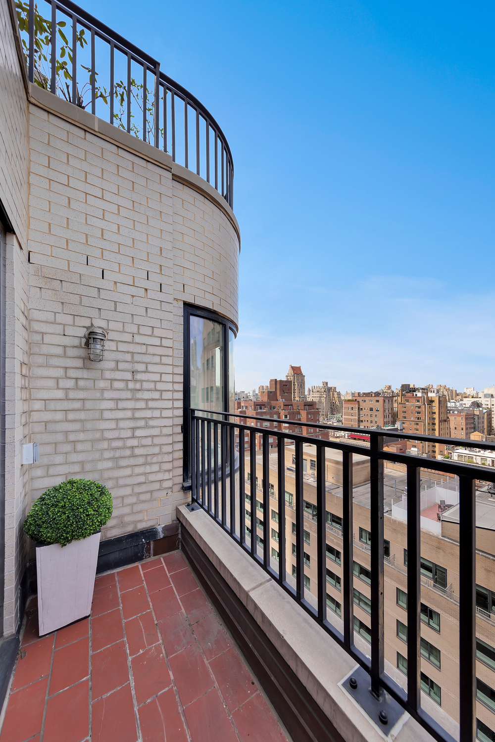 530 Park Avenue, Unit 19G Manhattan, NY 10065 - Photo 7 of 11 a view of a roof deck with potted plants