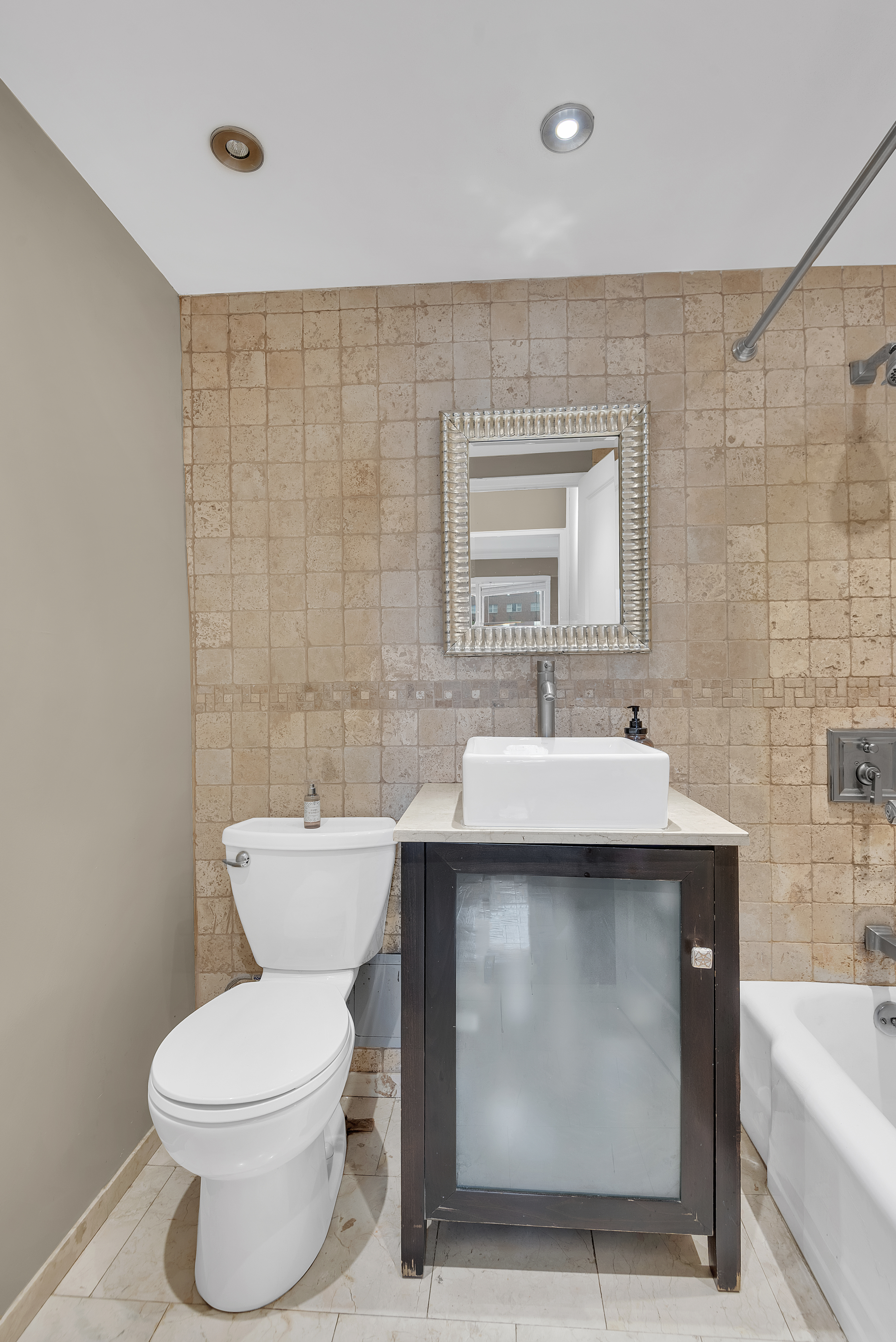 445 East 86th Street, Unit 6D Manhattan, NY 10028 - Photo 5 of 11 a bathroom with a sink toilet and shower