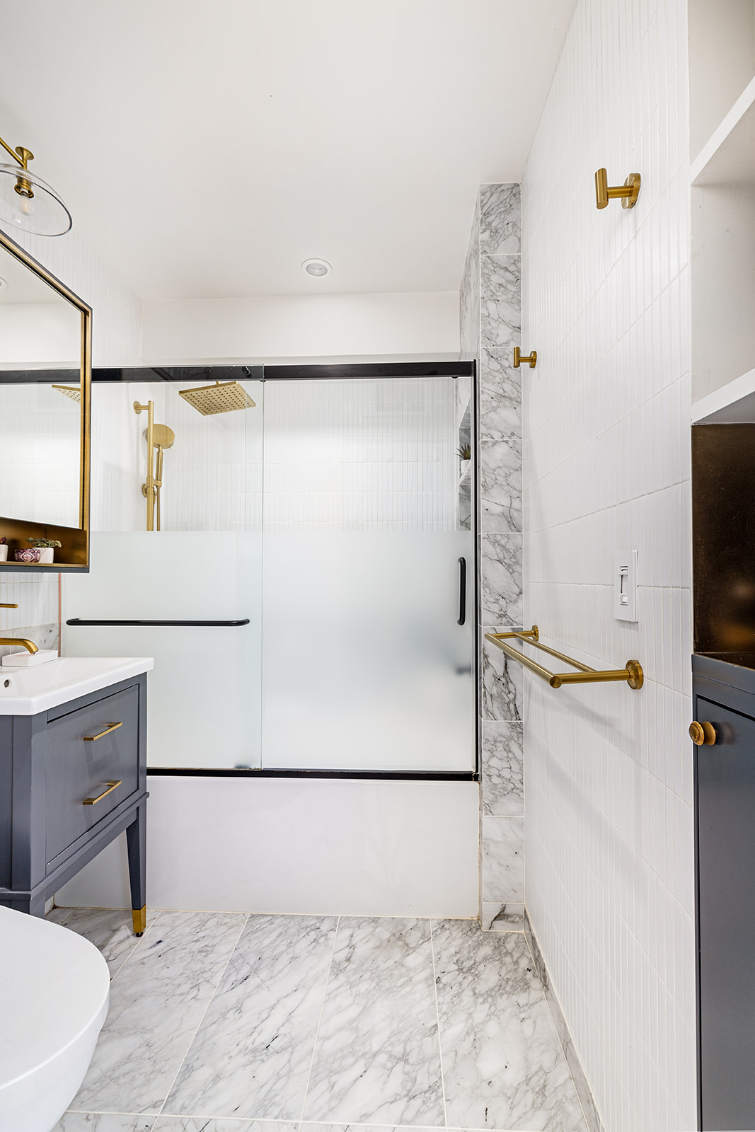 376 West Street, Unit 1A Manhattan, NY 10014 - Photo 4 of 11 a bathroom with a sink and a shower