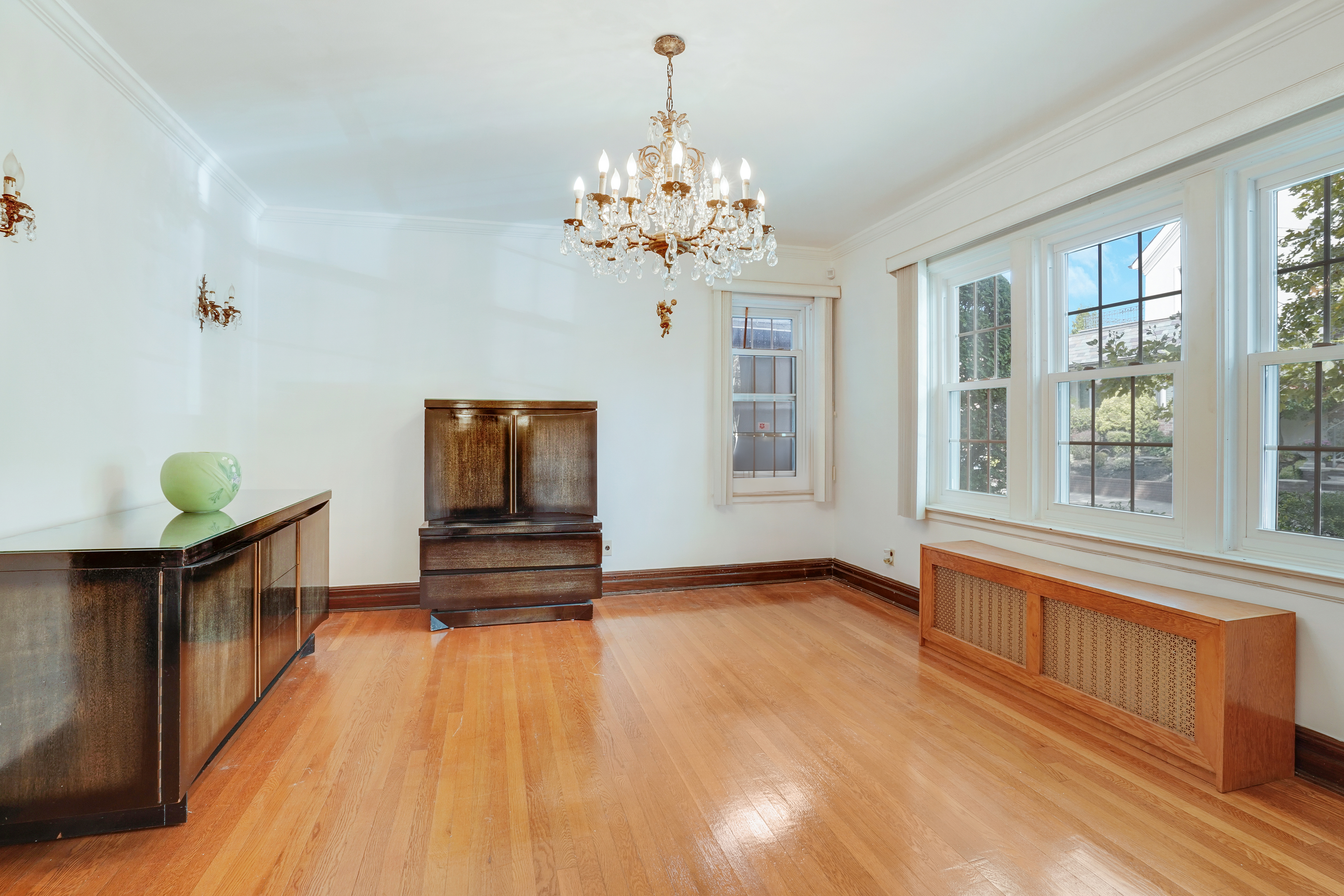 8028 Harbor View Terrace Brooklyn, NY 11209 - Photo 2 of 16 a view of hallway with chandelier and wooden floor