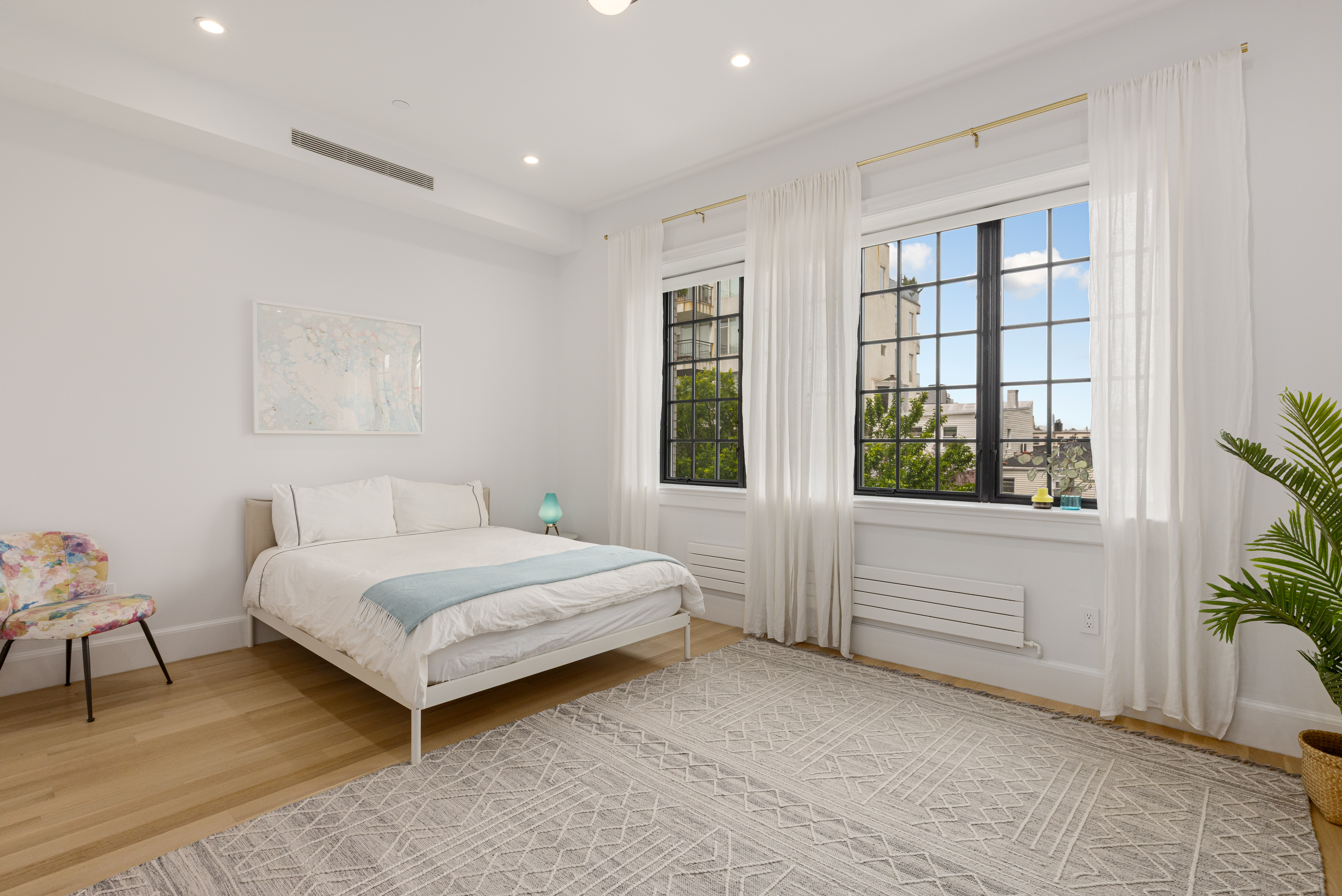 179 Devoe Street Brooklyn, NY 11211 - Photo 12 of 20 a bedroom with a bed and a window