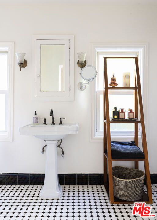 a bathroom with a sink a toilet and vanity