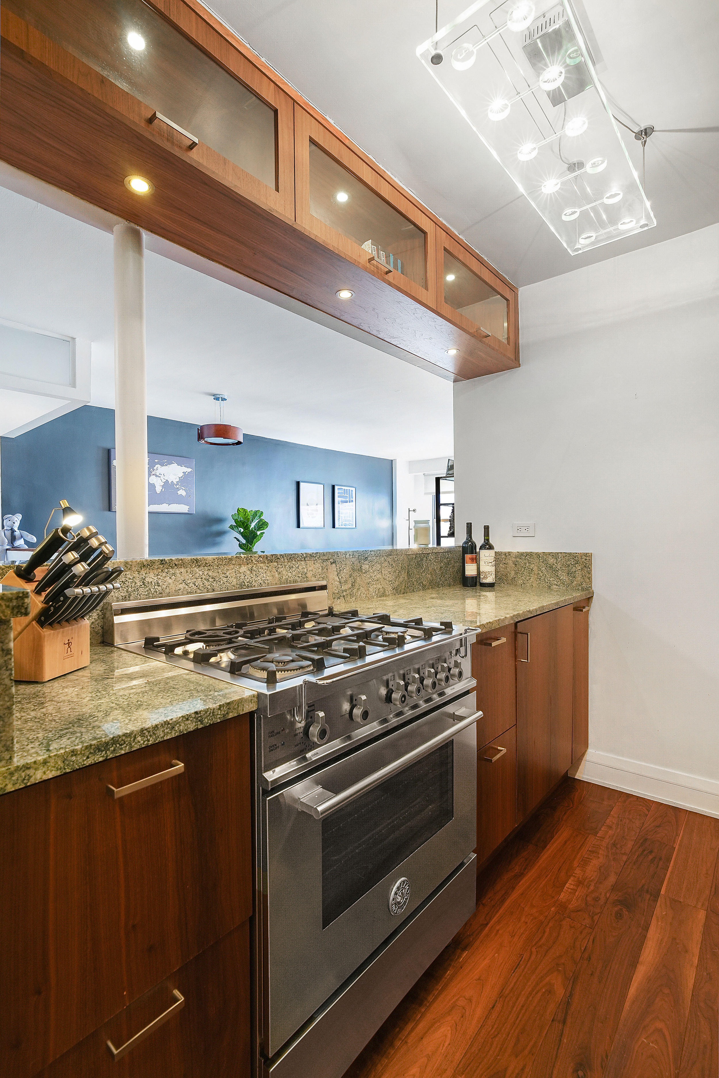 220 East 54th Street, Unit 11H Manhattan, NY 10022 - Photo 4 of 13 a kitchen with a stove and a sink