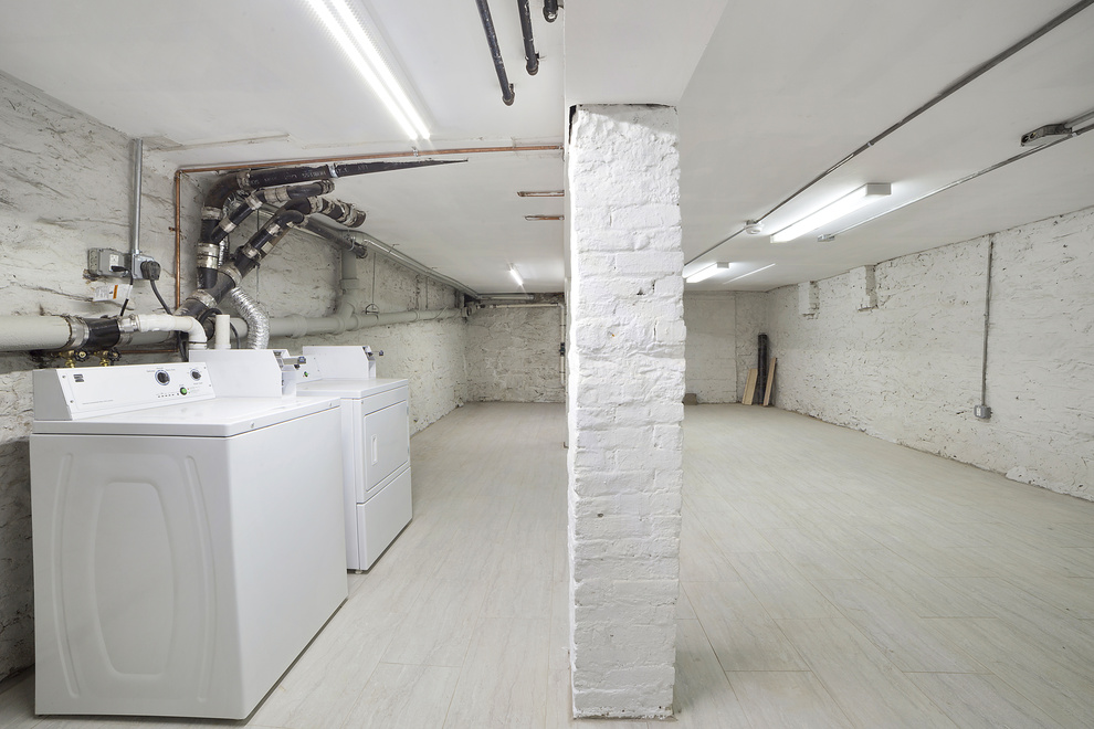 208 Lenox Road, Unit 3 Brooklyn, NY 11226 - Photo 6 of 7 a utility room with cabinets washer and dryer