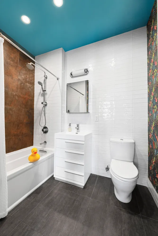 a bathroom with a toilet a sink and bathtub