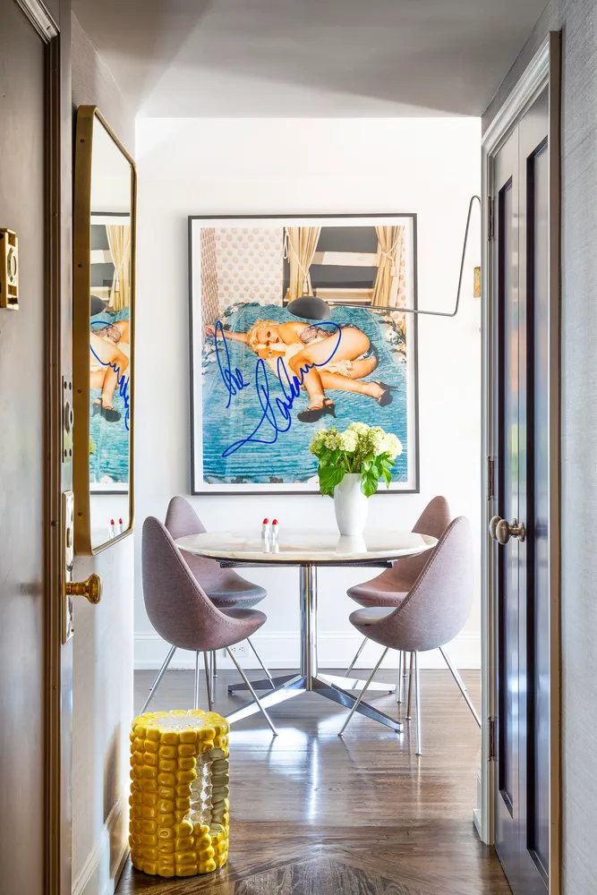 a dining room with furniture and wooden floor