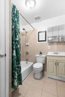 a bathroom with a sink a toilet and bathtub