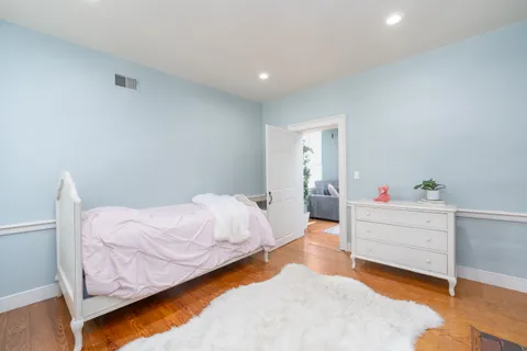 a bedroom with furniture and a fireplace