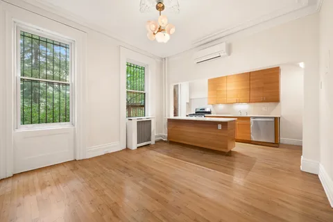 a view of kitchen with wooden floor and windows