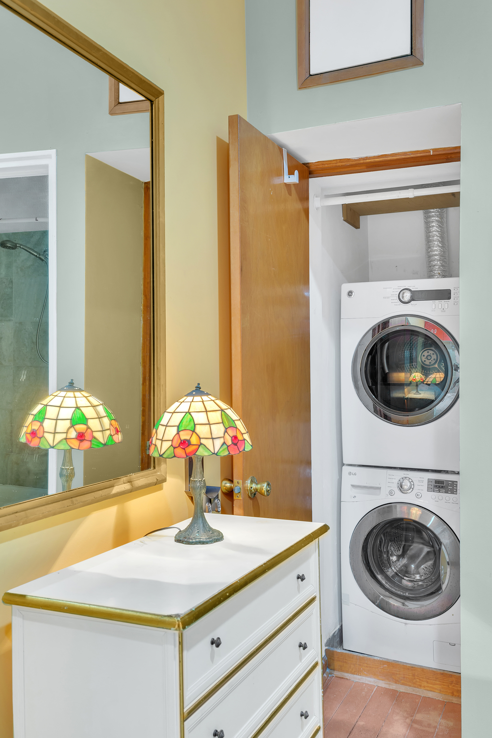 57 West 58th Street, Unit 3D Manhattan, NY 10019 - Photo 5 of 7 a view of bathroom with washer and dryer
