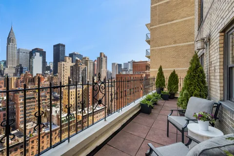 a view of a balcony with city view