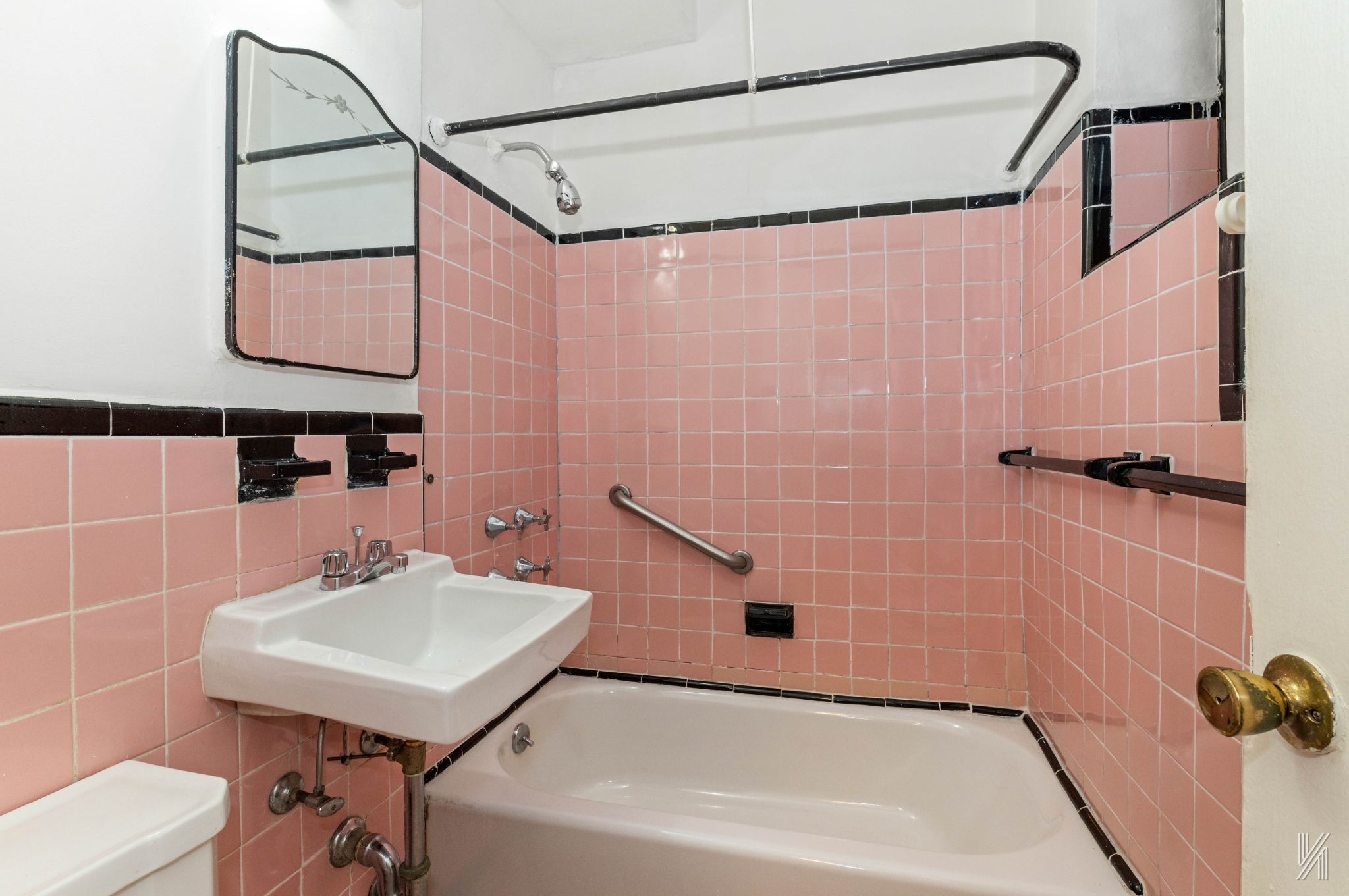 22-60 79th Street, Unit 1A Queens, NY 11370 - Photo 14 of 17 a bathroom with a sink a shower and a mirror
