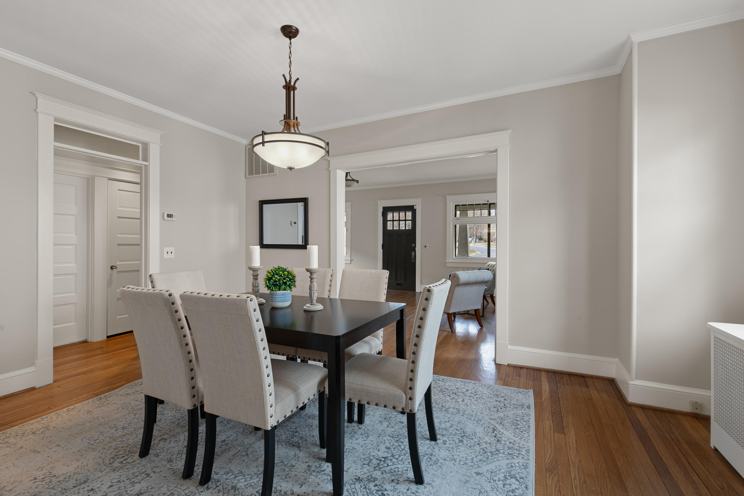 1908 Glen Ross Road Silver Spring, MD 20910 - Photo 13 of 63 a dining room with furniture wooden floor a rug and a chandelier