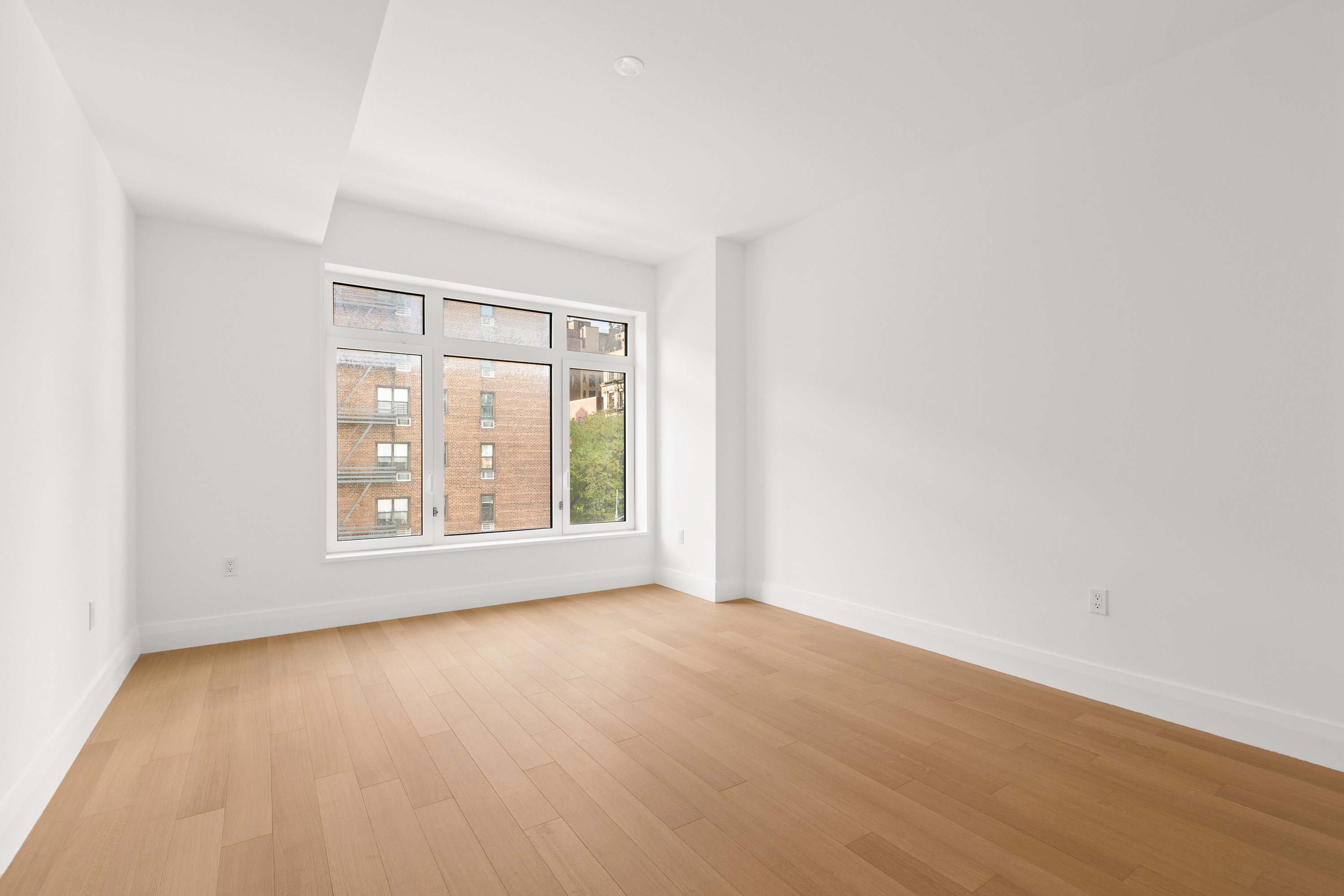 200 East 83rd Street, Unit 5D Manhattan, NY 10028 - Photo 6 of 29 a view of an empty room with a window