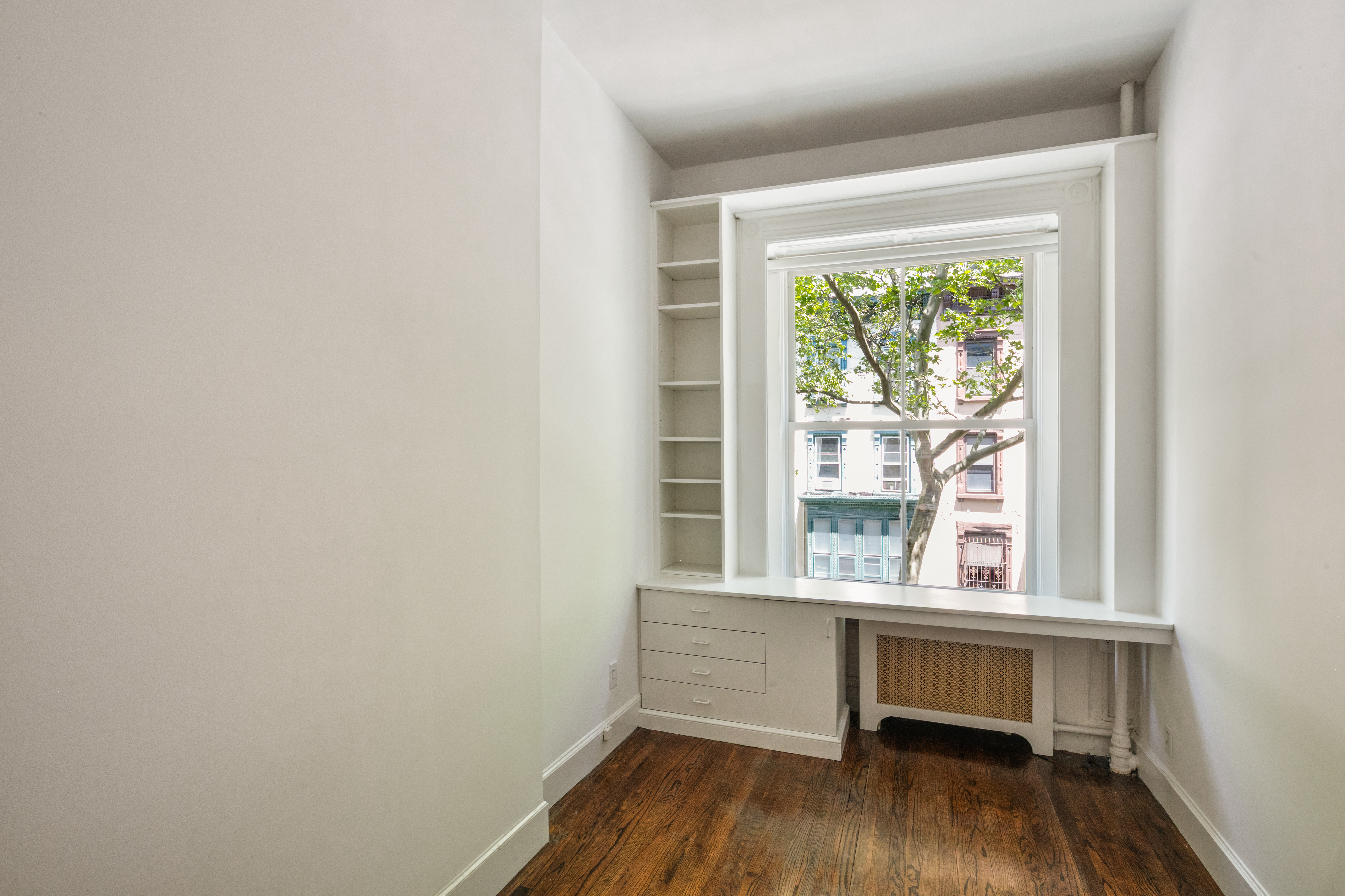 112 West 78th Street, Unit PARLOR Manhattan, NY 10024 - Photo 29 of 37 a view of a room with wooden floor and a window