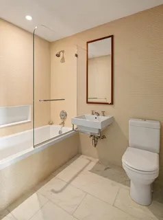 a bathroom with a toilet a sink and a bathtub