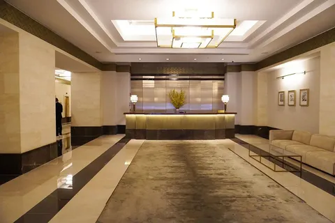 a living room with a couch and a chandelier