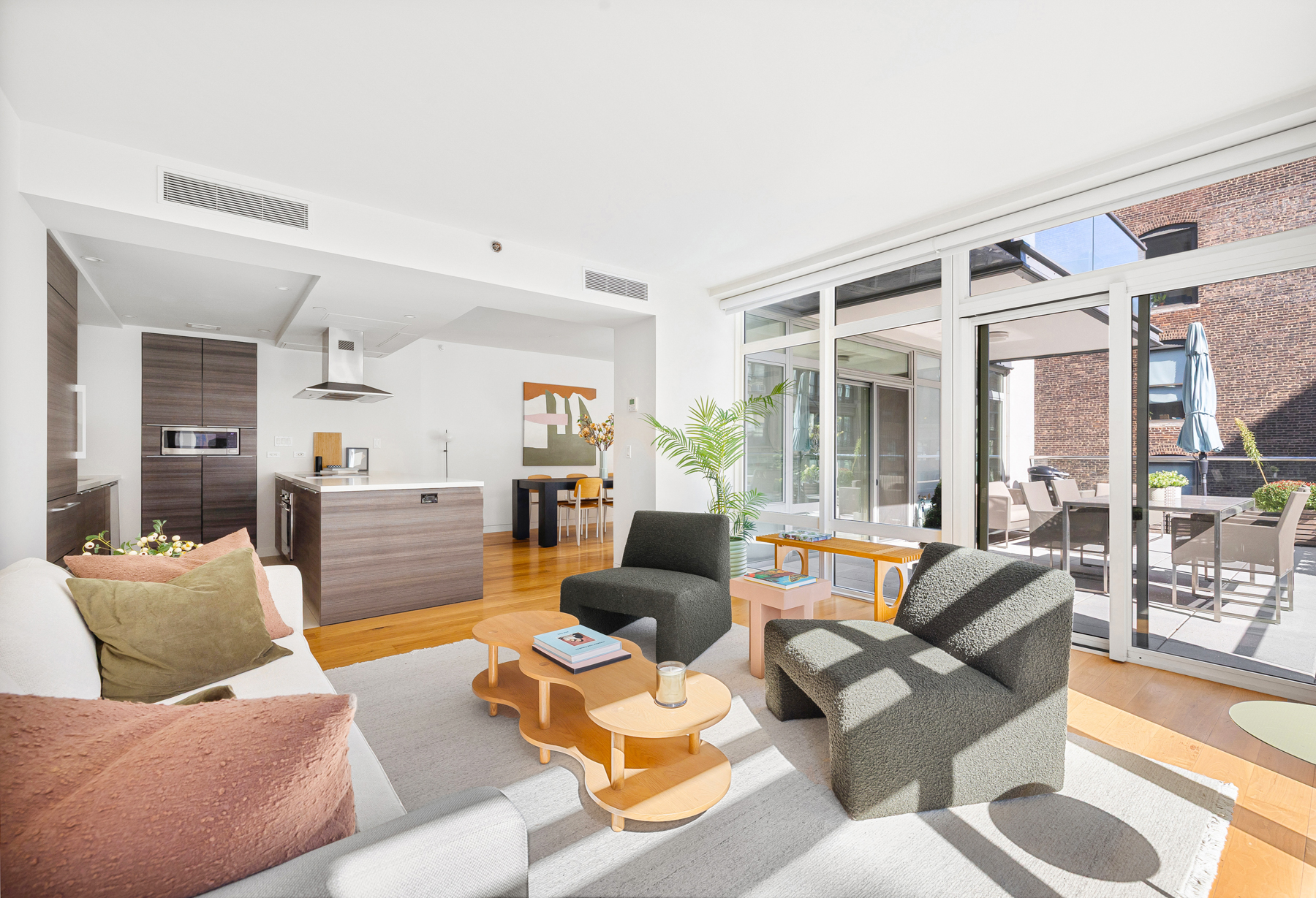 151 West 21st Street, Unit 10A Manhattan, NY 10011 - Photo 1 of 26 a living room with furniture and a large window