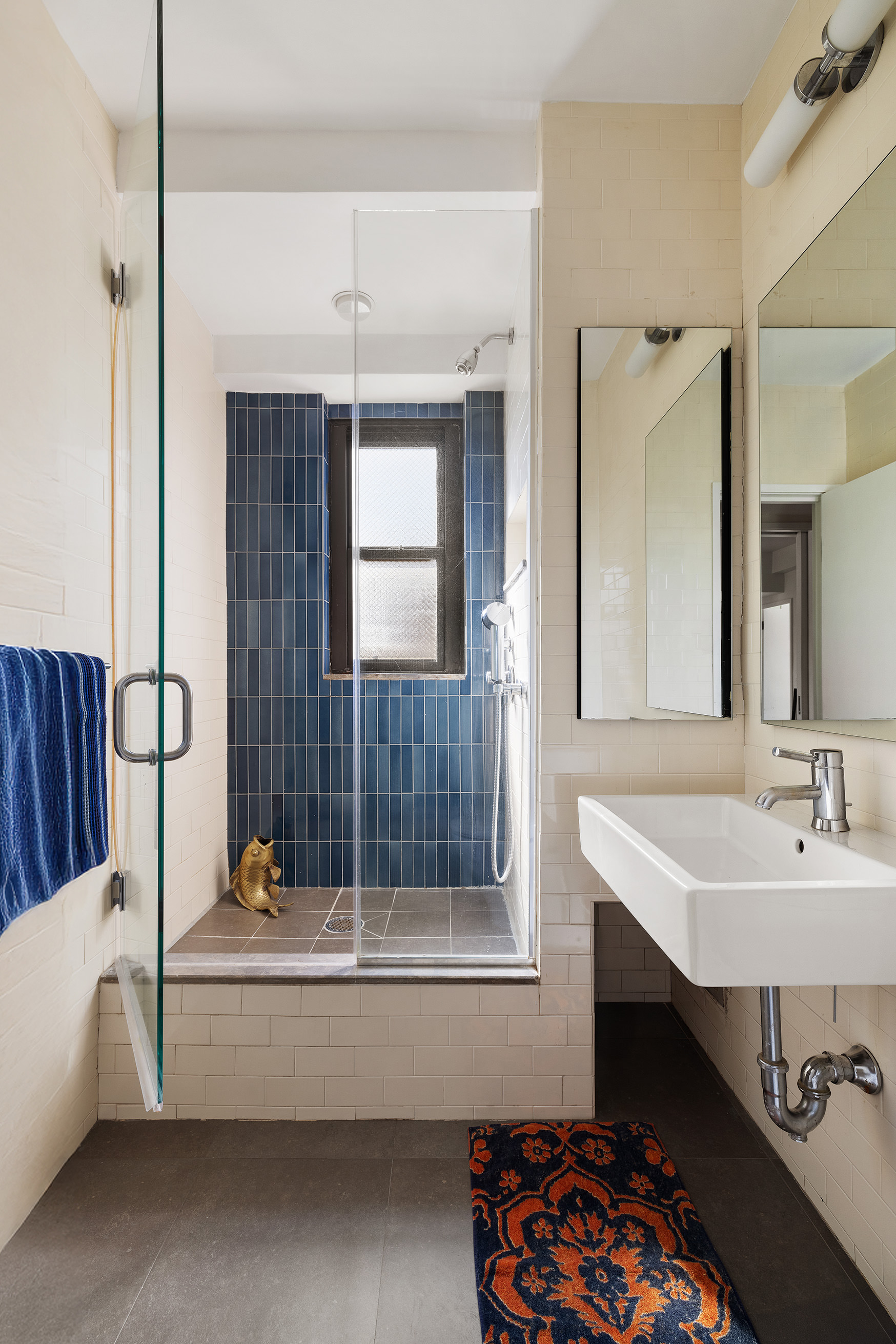 360 West 22nd Street, Unit 12B Manhattan, NY 10011 - Photo 8 of 16 a bathroom with a sink and a mirror