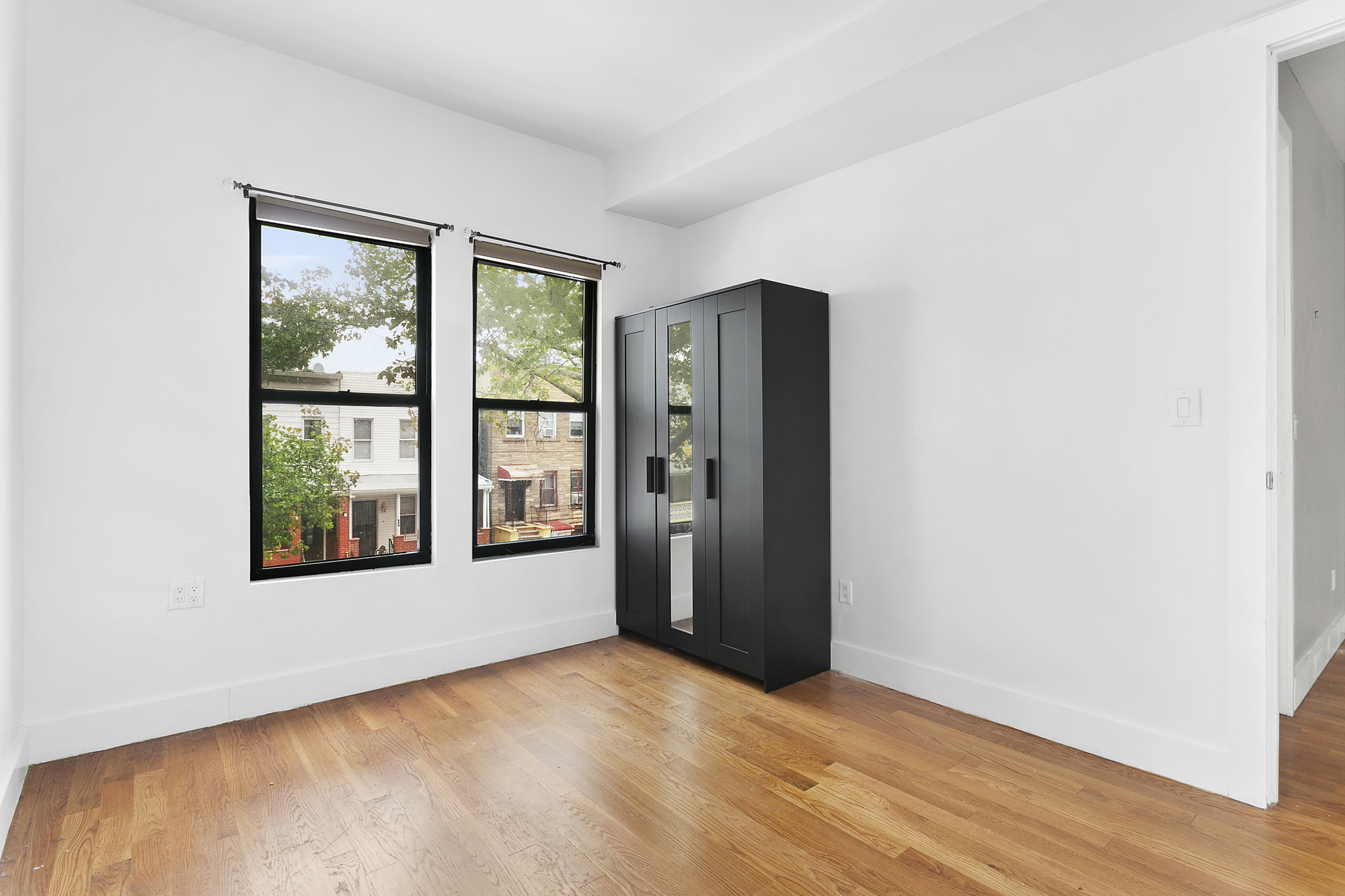 342 East 9th Street Brooklyn, NY 11218 - Photo 7 of 12 an empty room with windows and closet