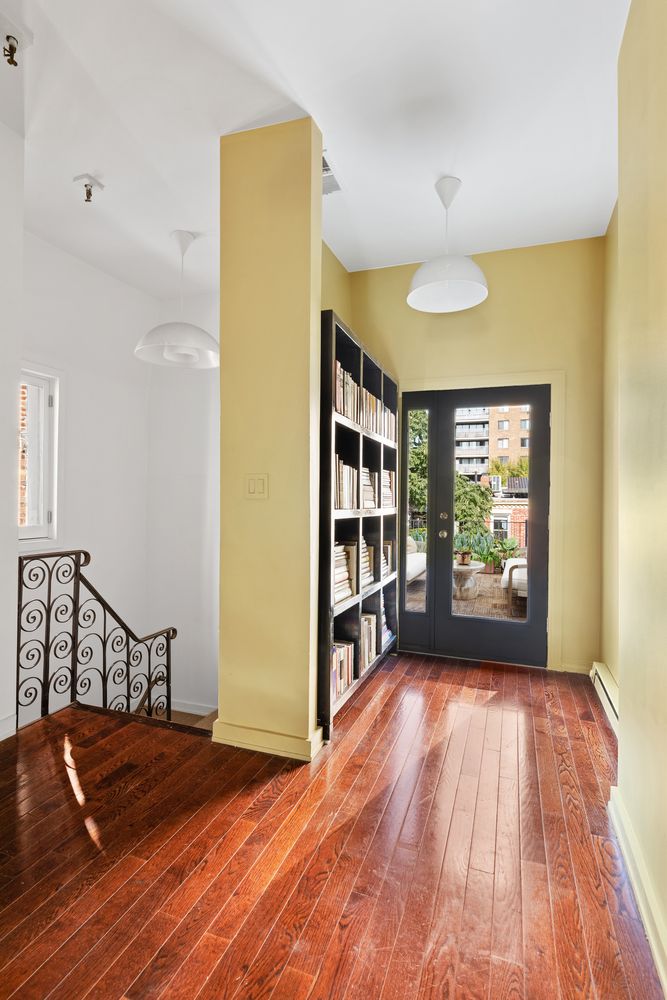 315 Washington Avenue Brooklyn, NY 11205 - Photo 24 of 38 a view of an empty room with a window and wooden floor