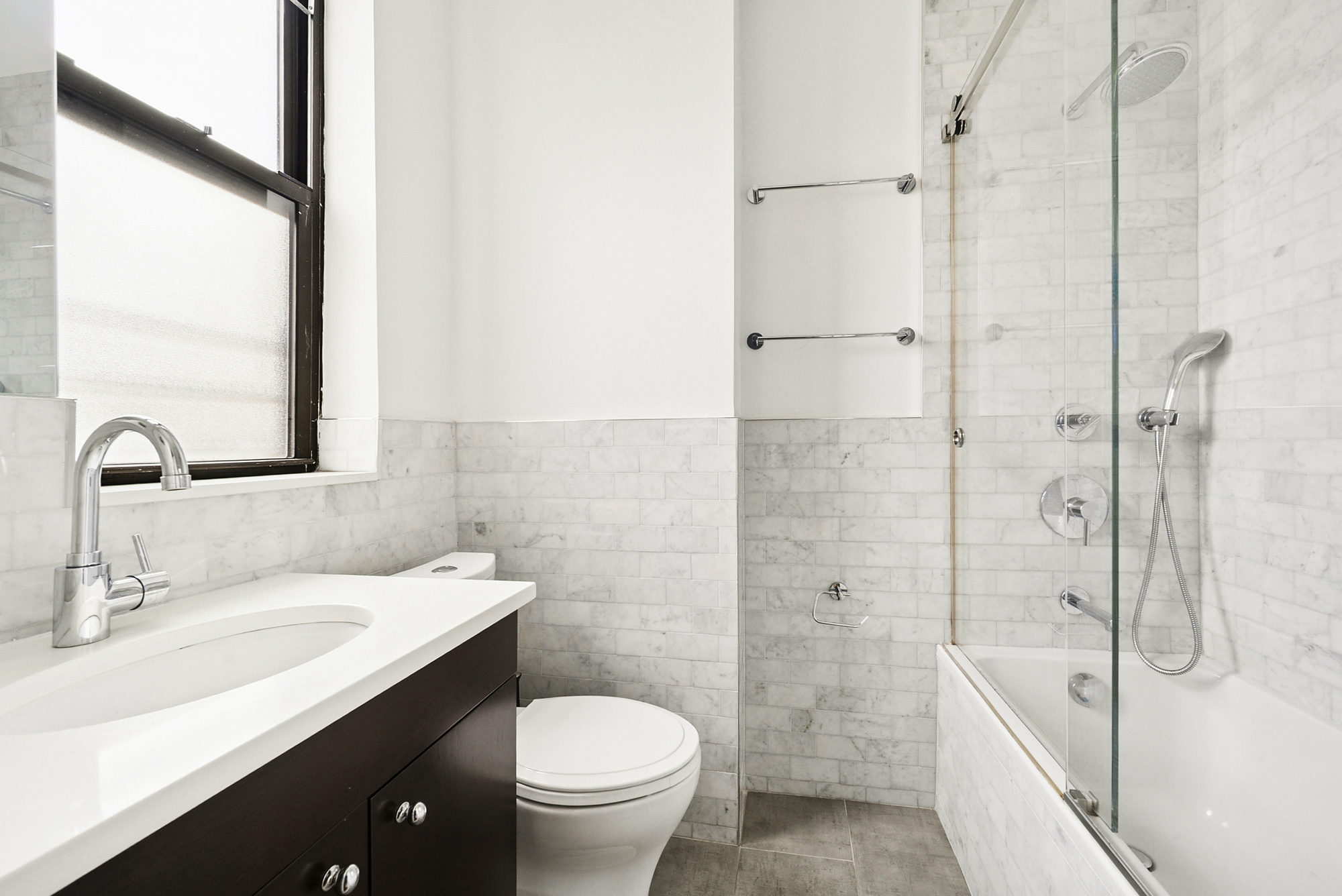514 West End Avenue, Unit 14A Manhattan, NY 10024 - Photo 5 of 9 a bathroom with a sink toilet and shower