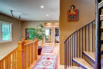a view of entryway with stairs and wooden floor