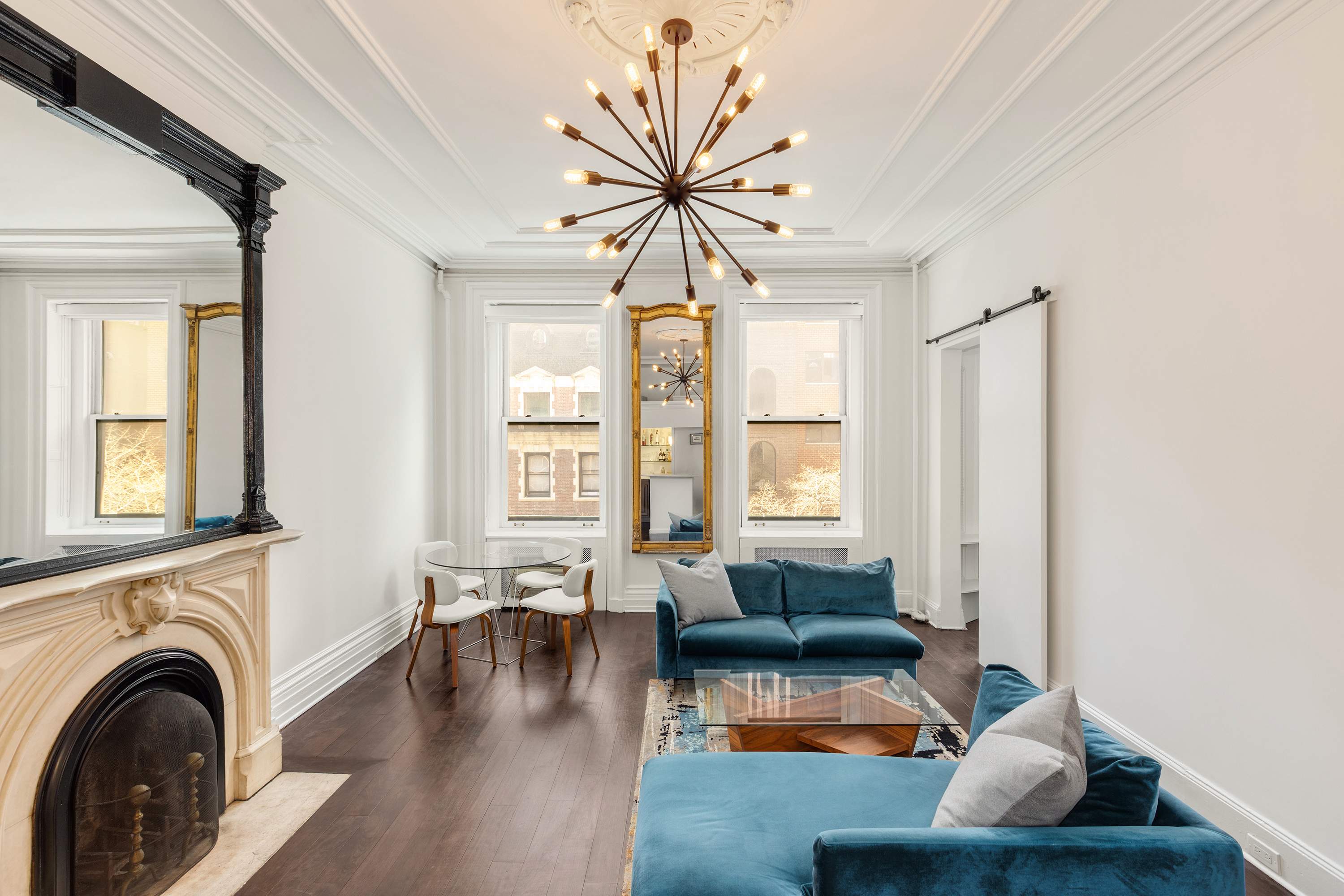 111 East 36th Street, Unit 4A Manhattan, NY 10016 - Photo 4 of 19 a living room with furniture and a large window