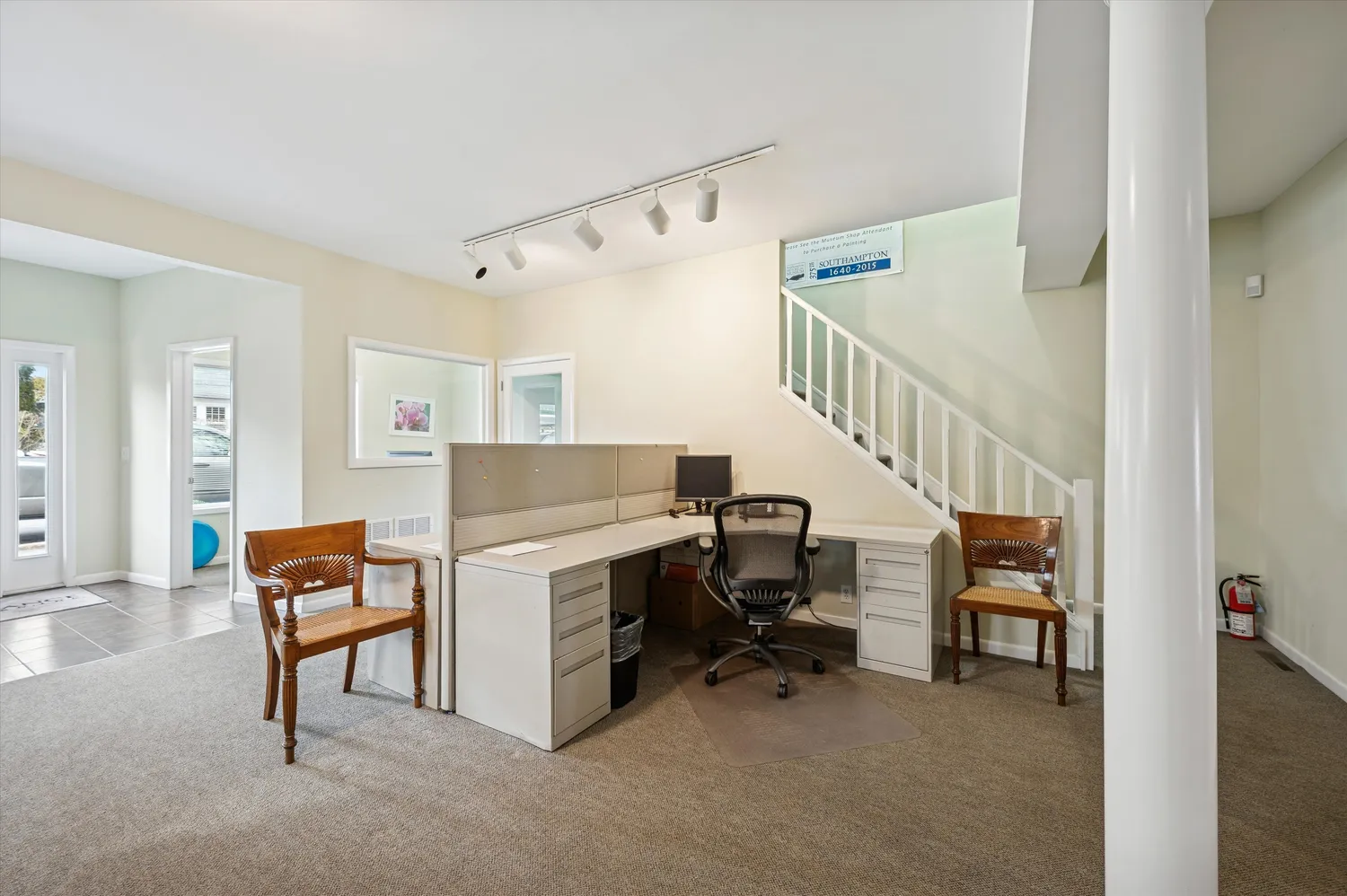 a room with two chairs and a window